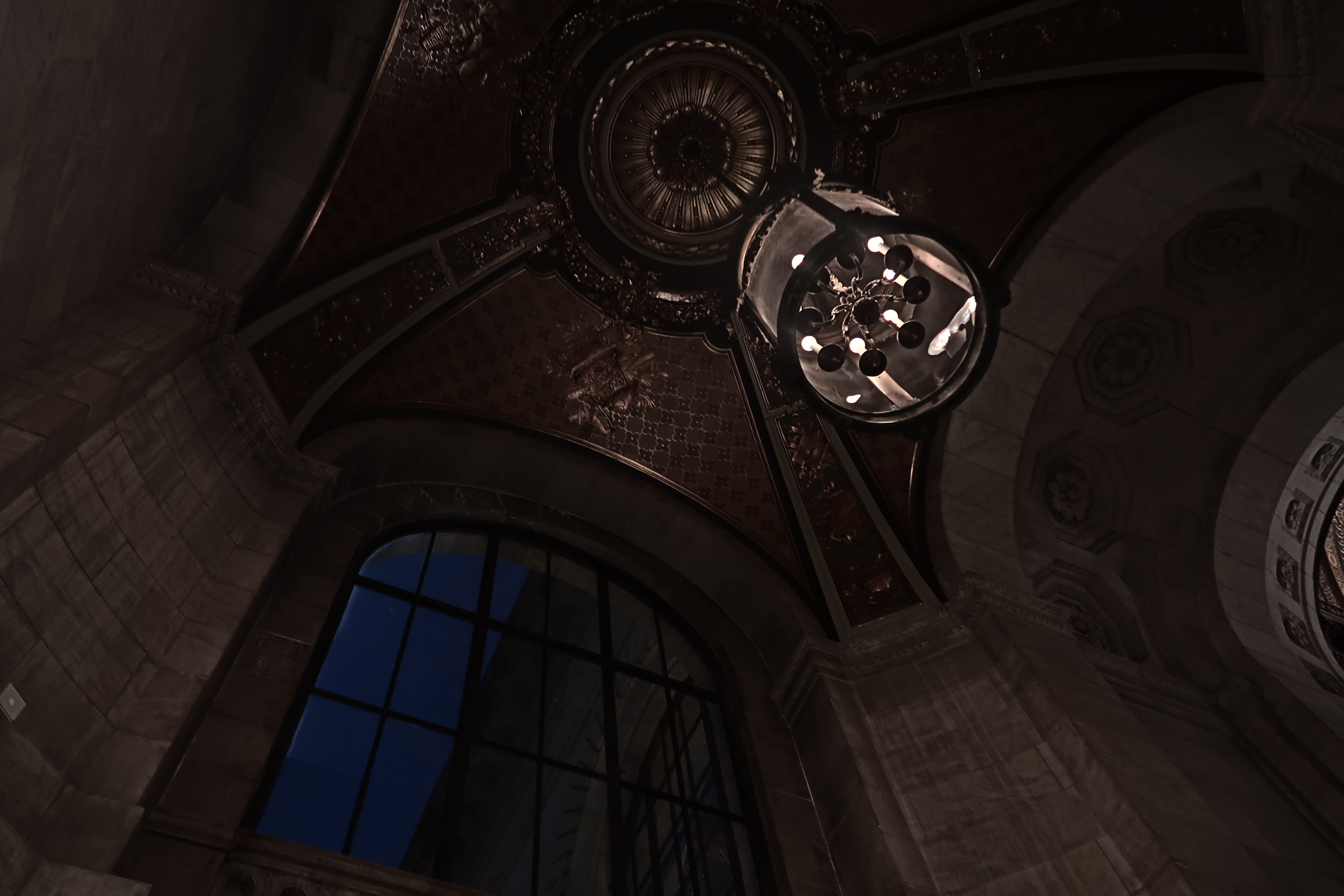 an upward view of the dark insides of a cathedral