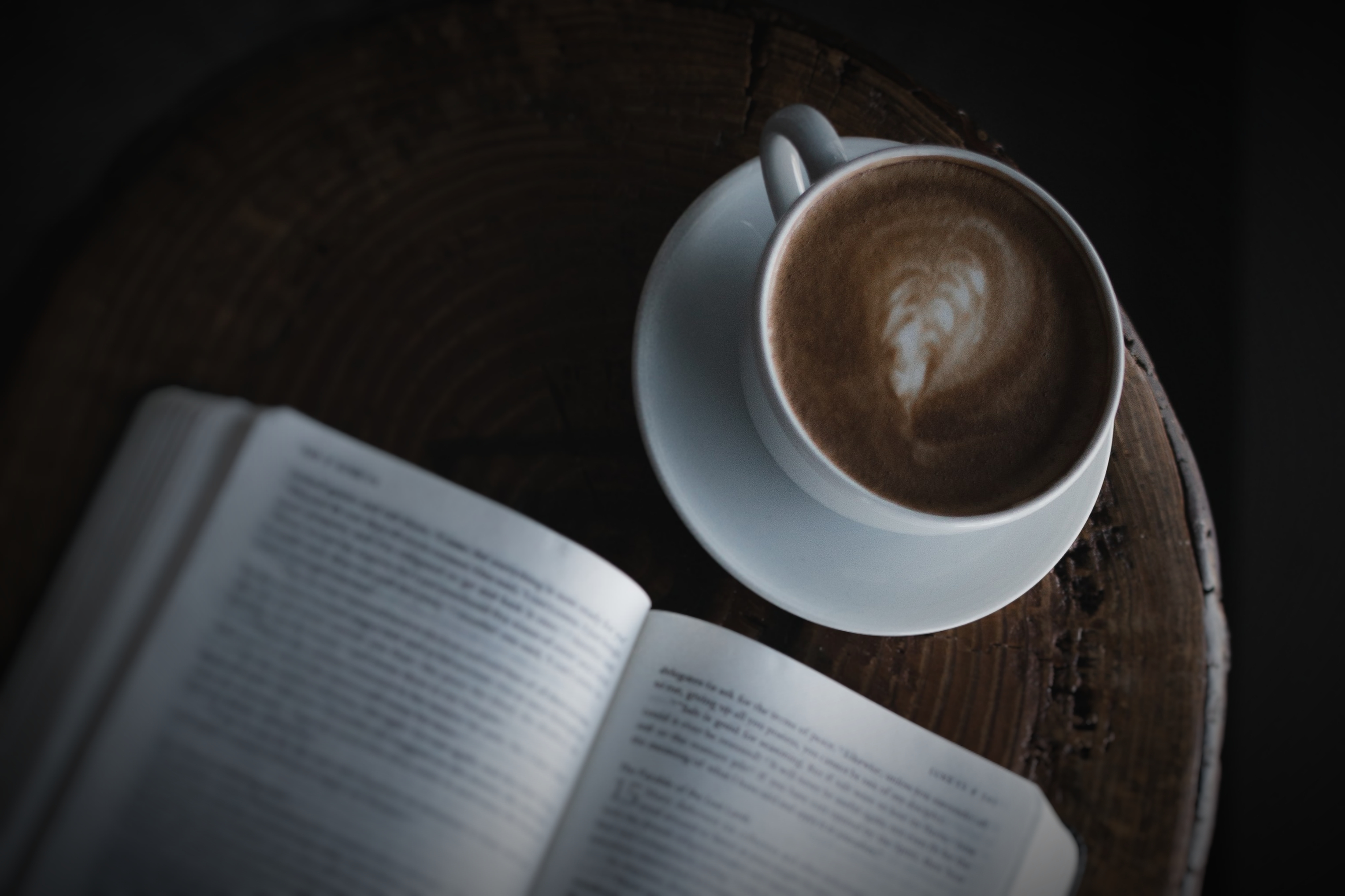 coffee cup and open book