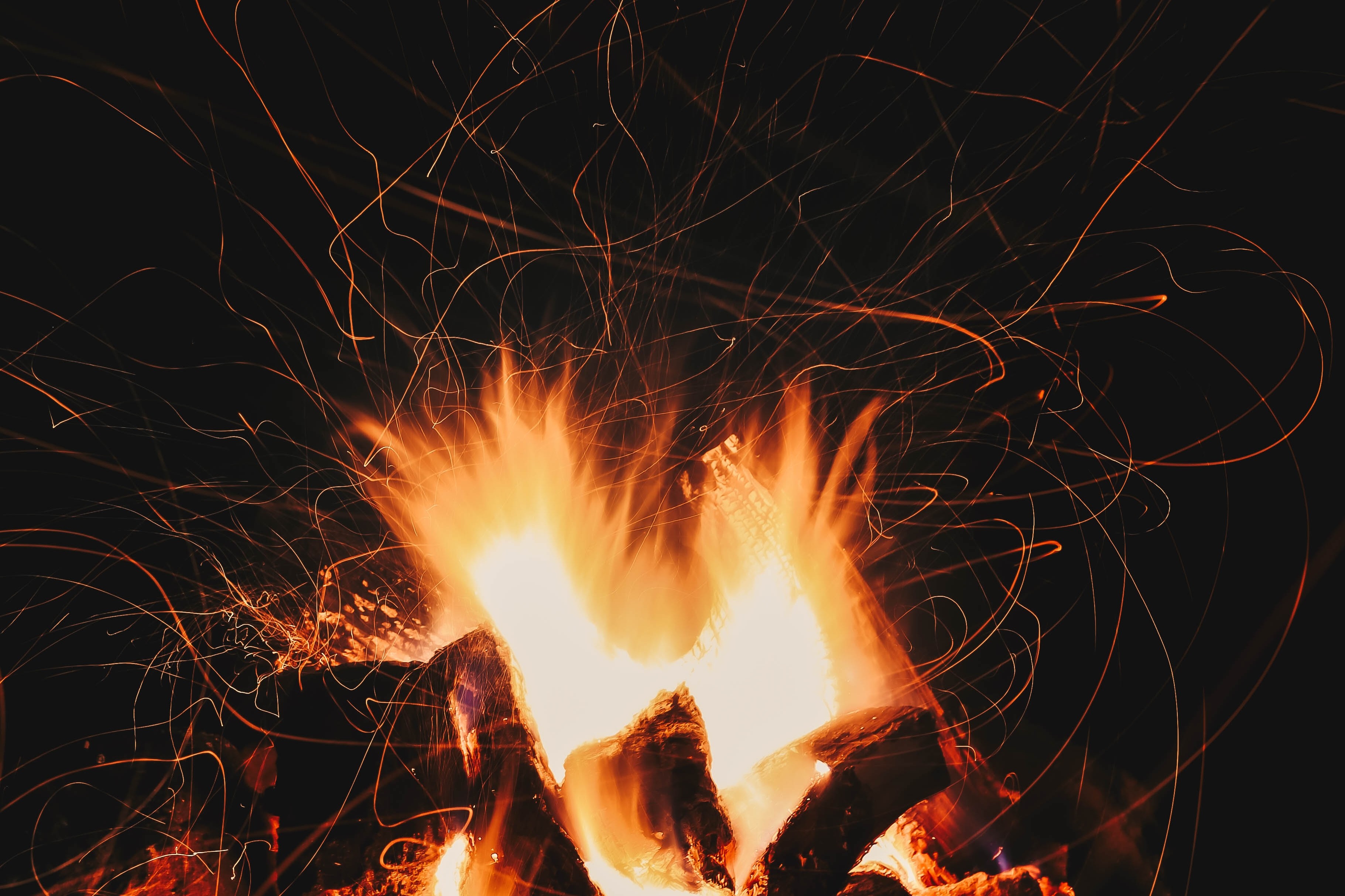 flame kindling against a dark background