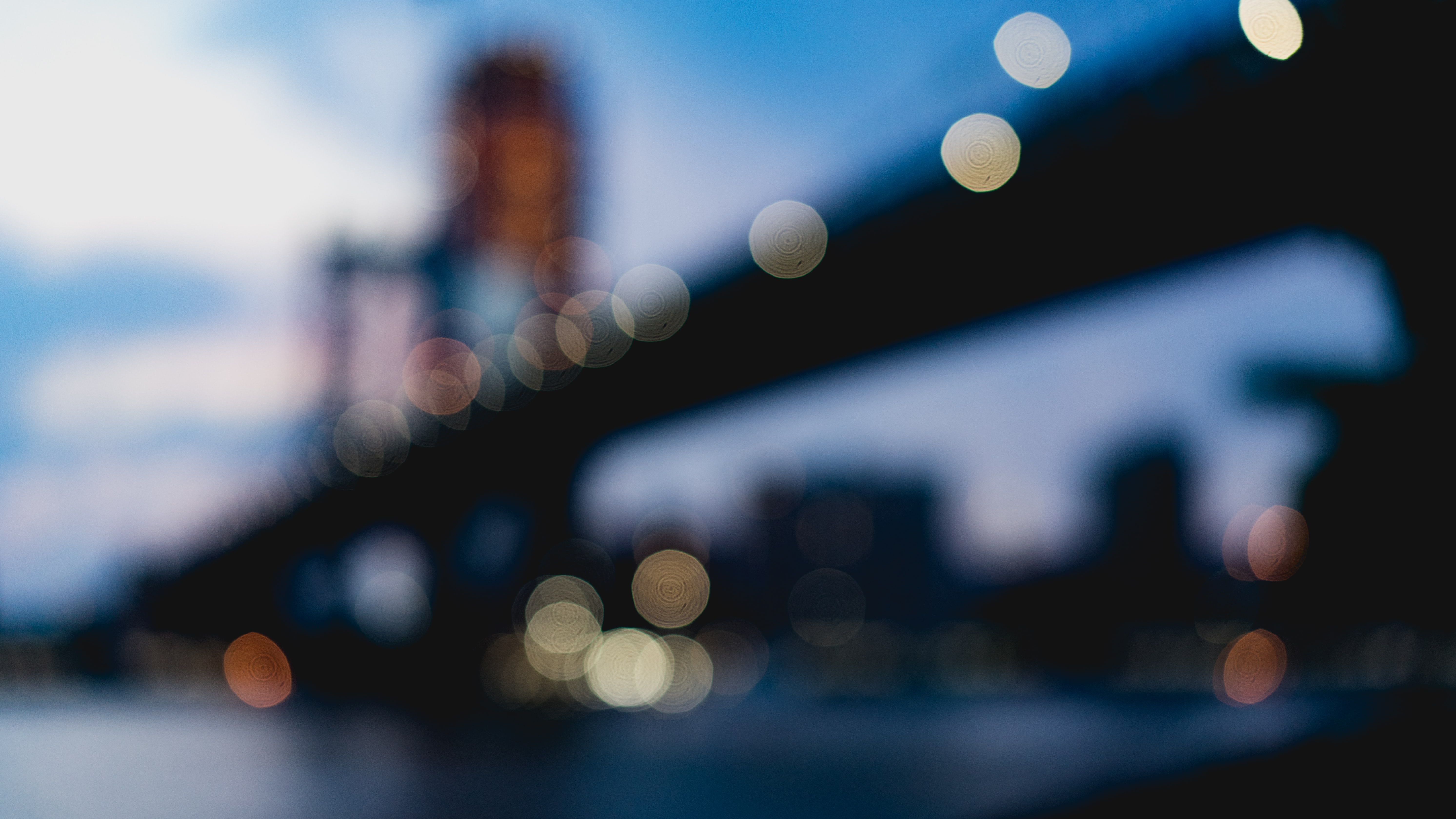 blurred city lights with bridge in background