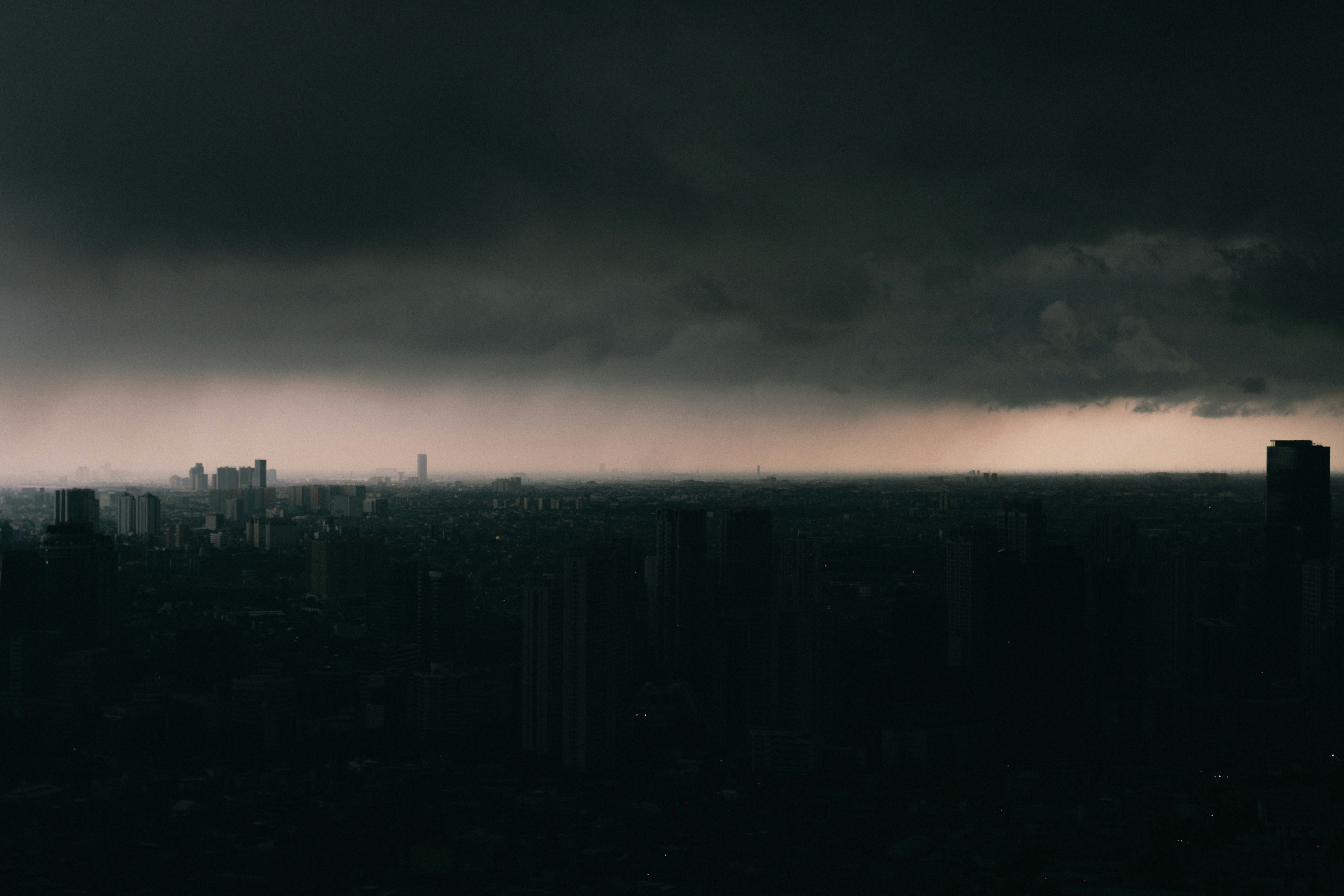 dark clouds over gray city