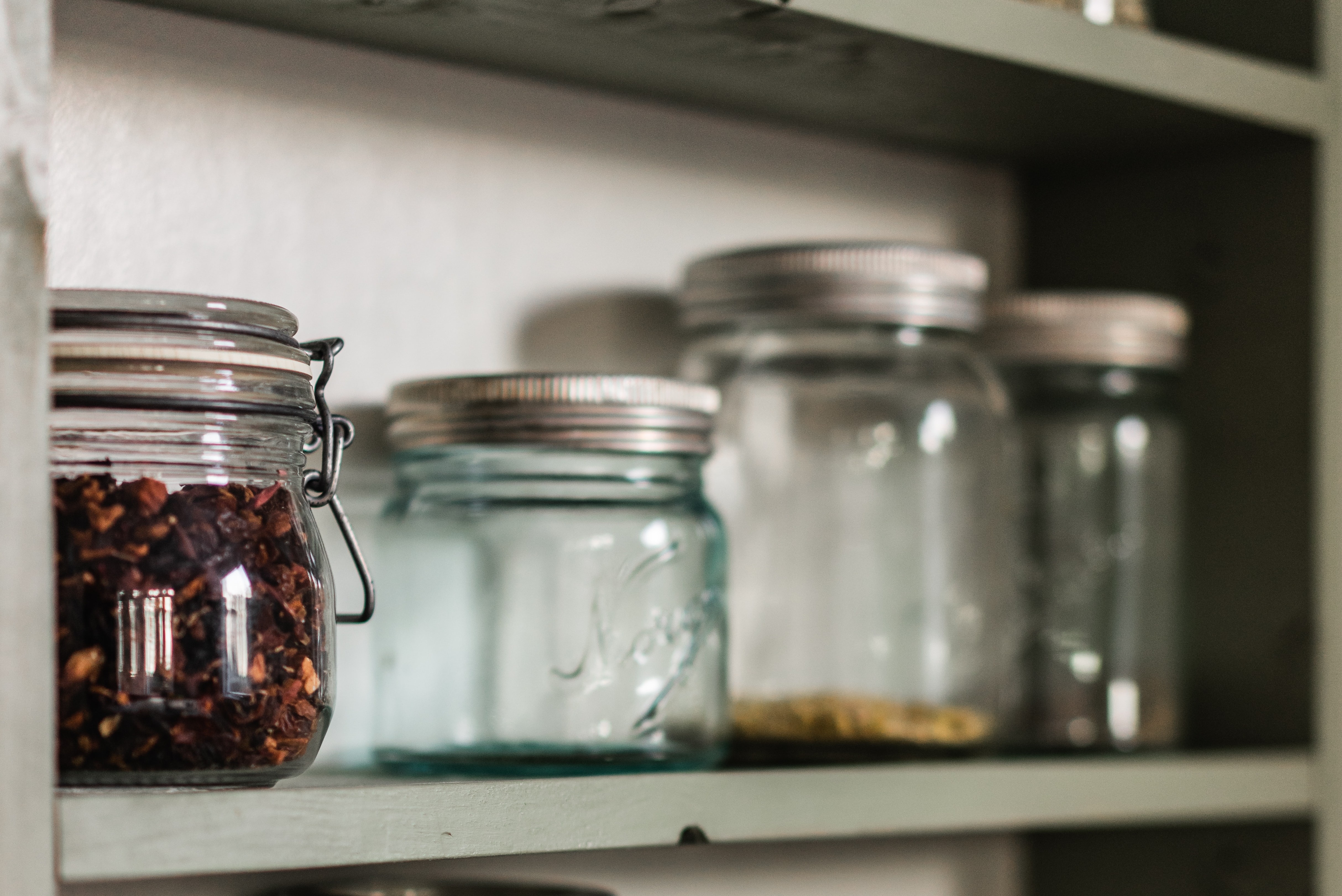 spice jars in a cupboard
