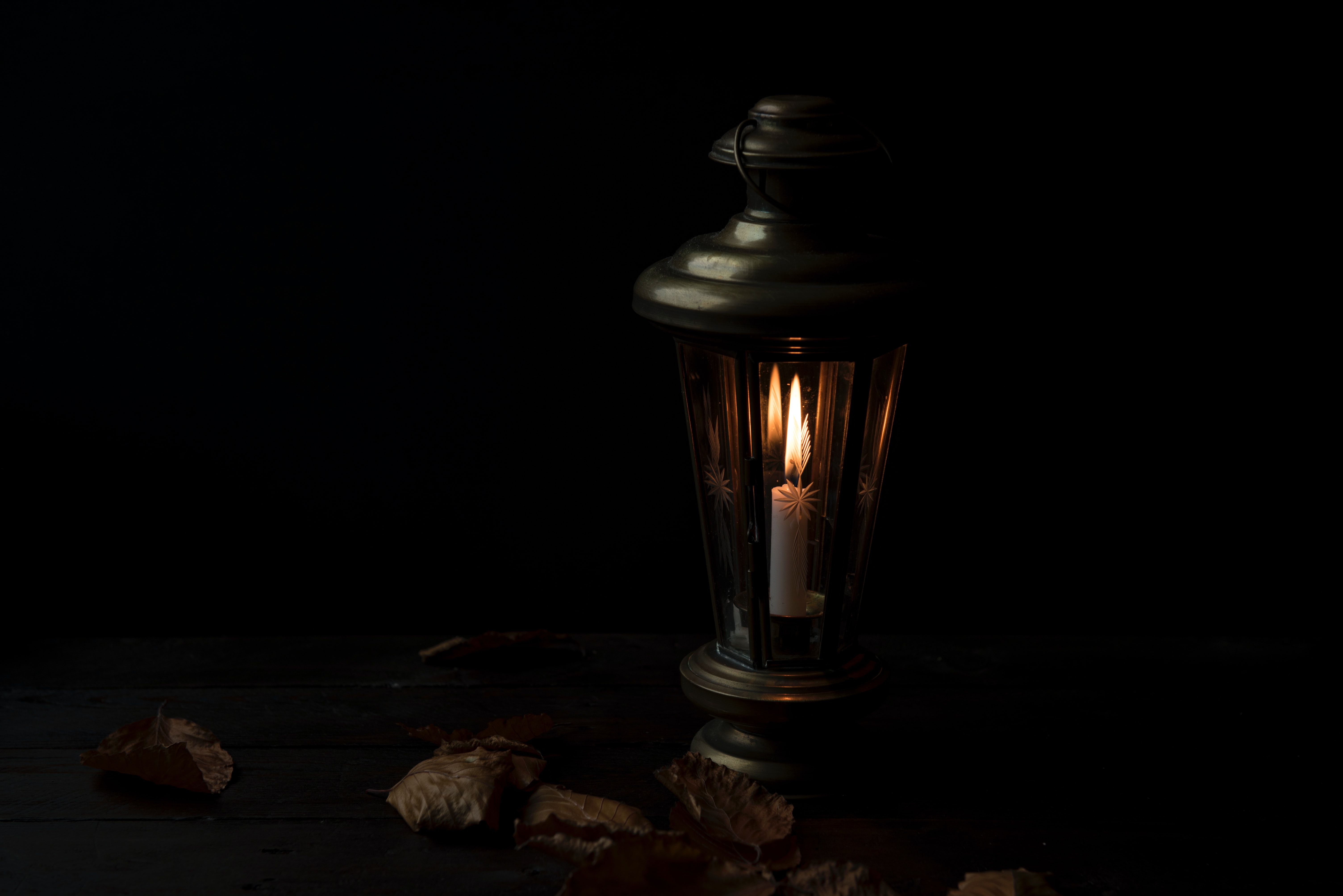 dimly lit lantern in darkness