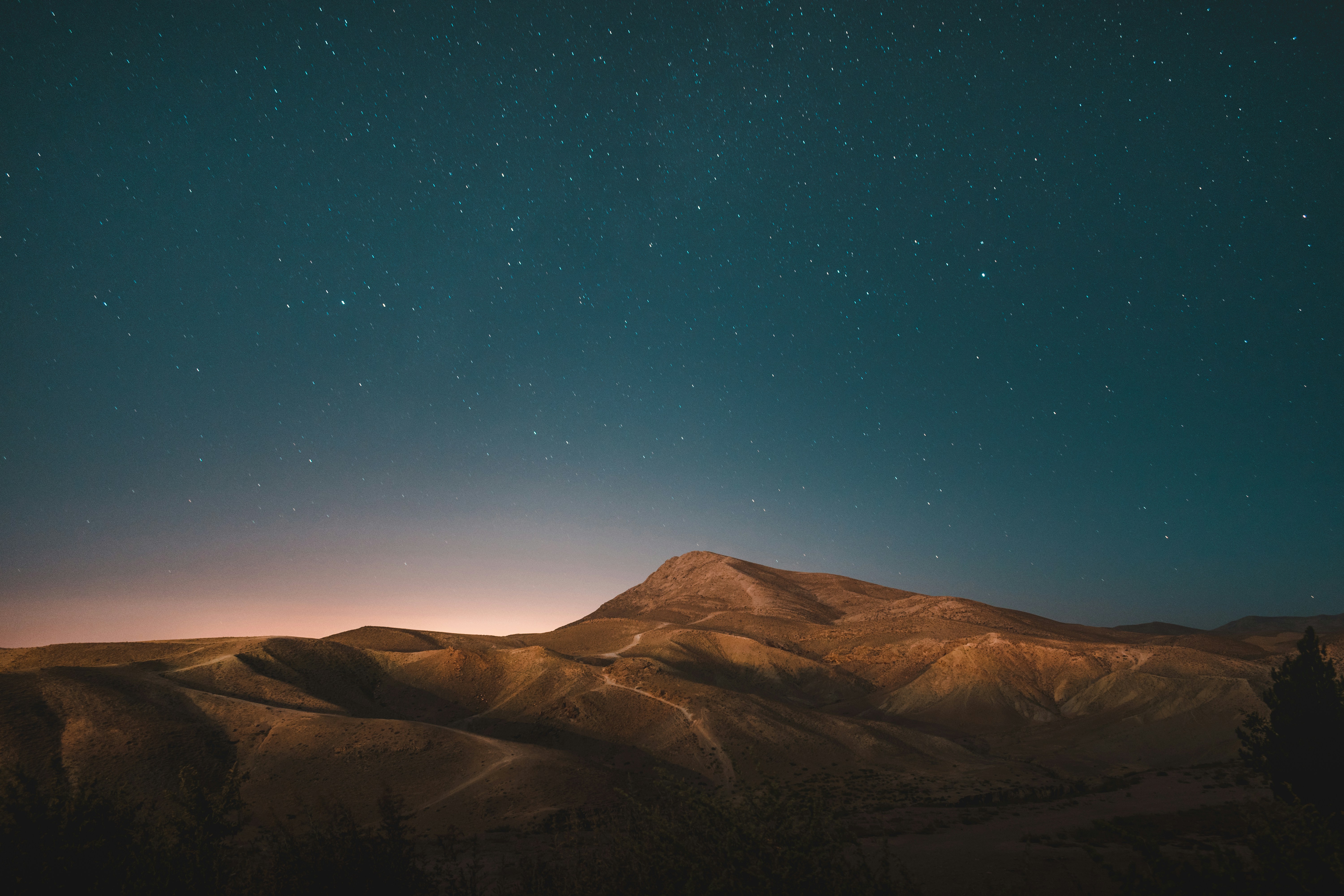 barren desert landscape with starry sky