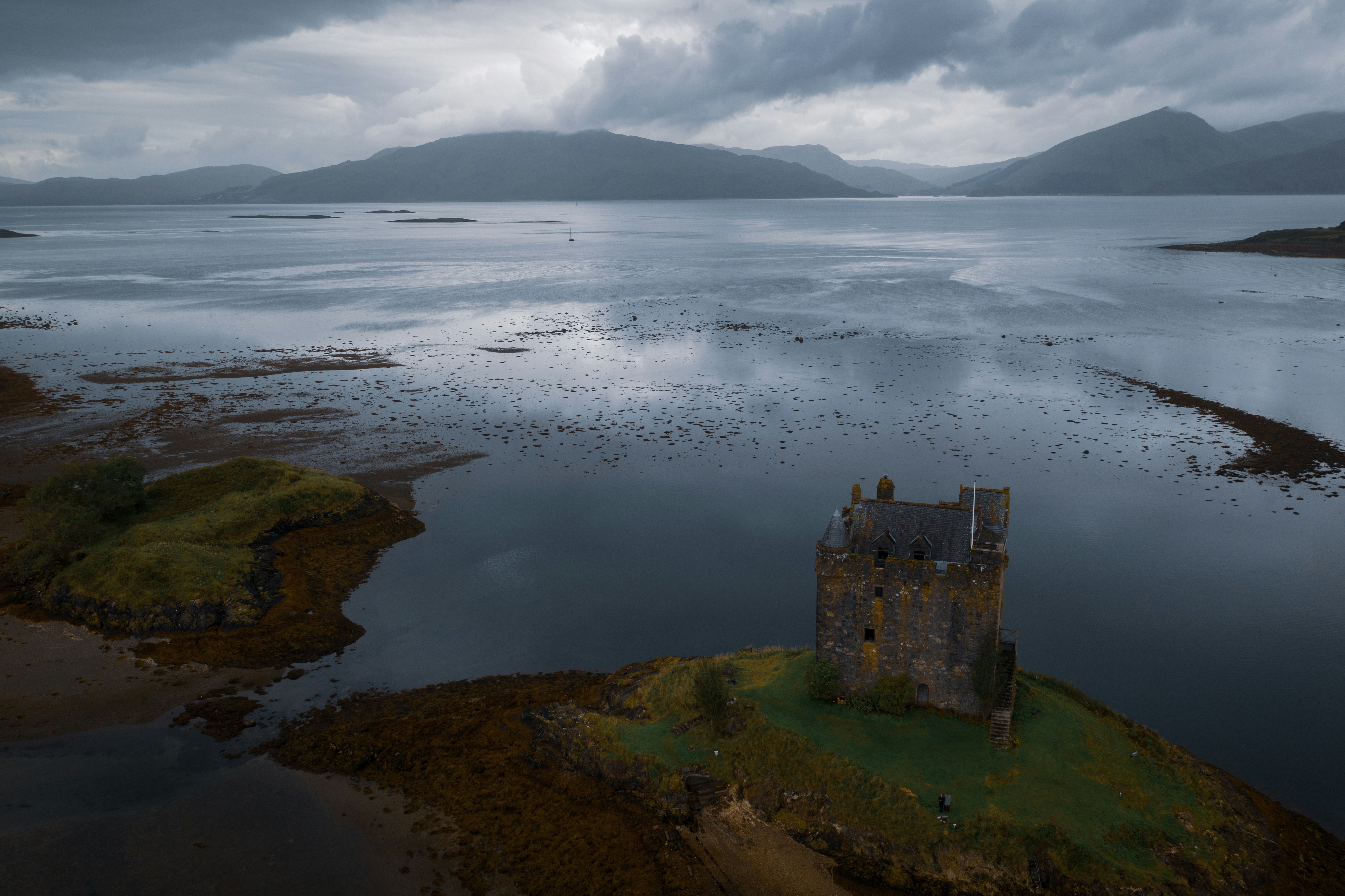 overhead view of castle building on shore