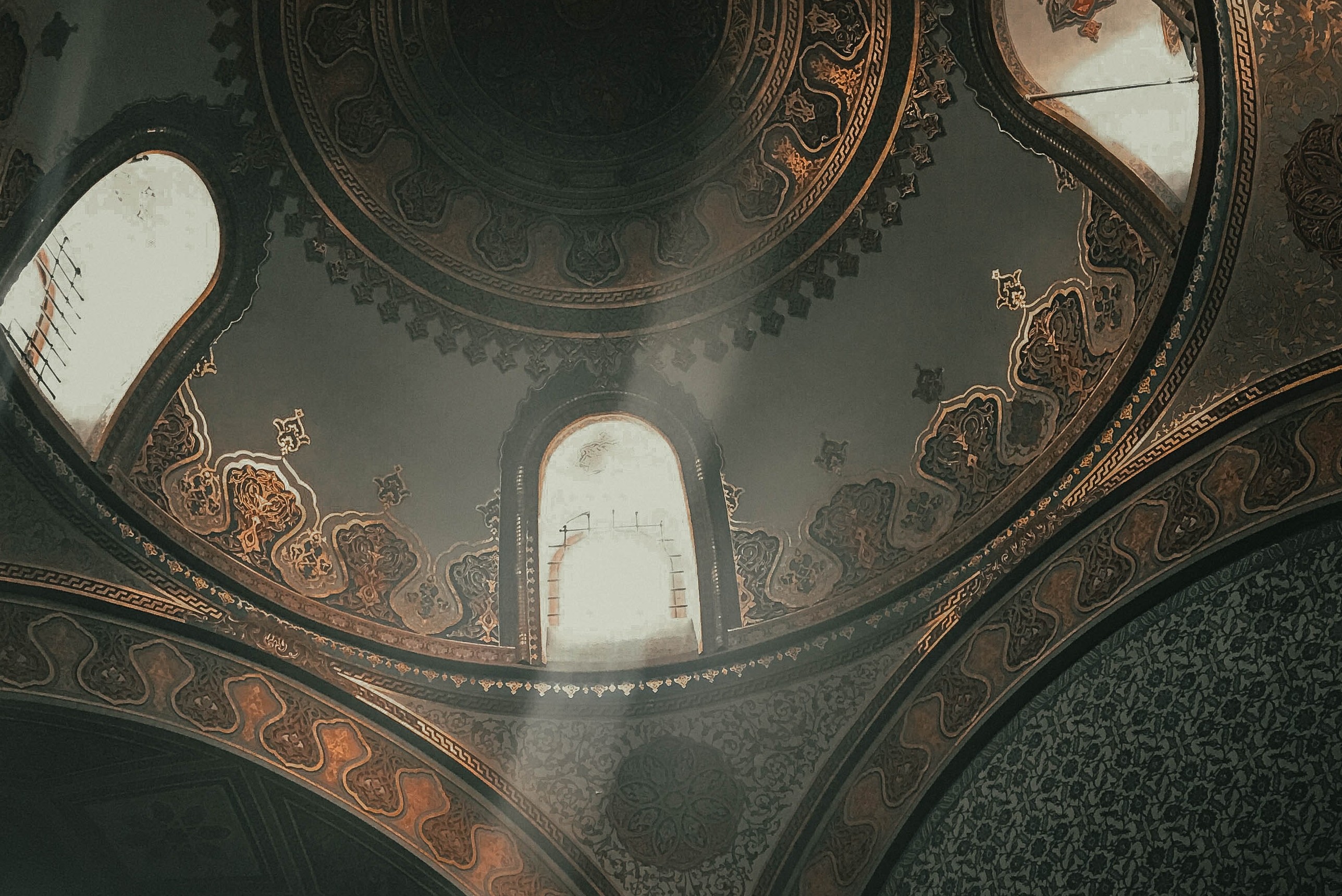 dim-lit interior of mosque ceiling