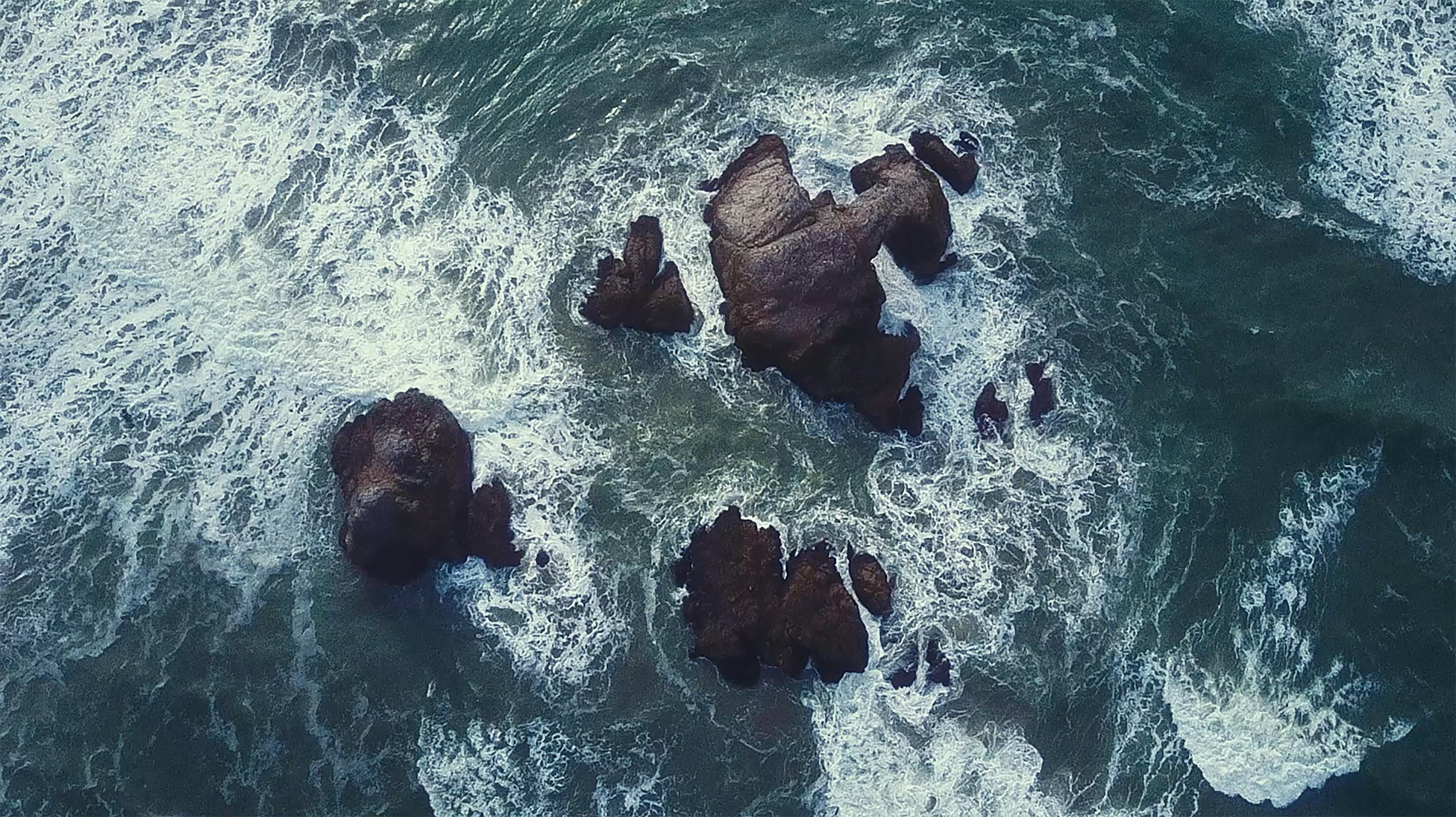 water churning around rocks