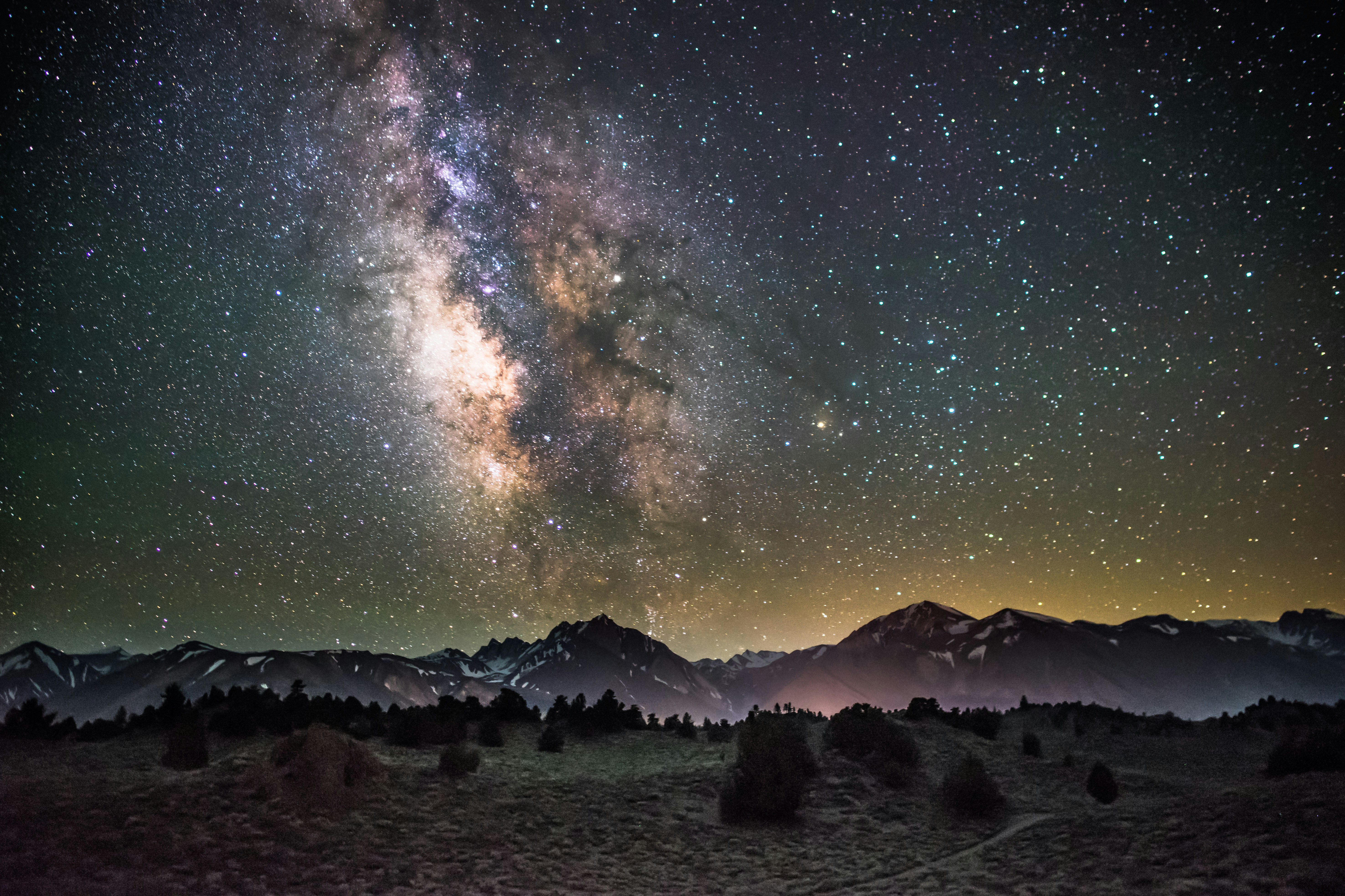 milky way and night sky over mountains