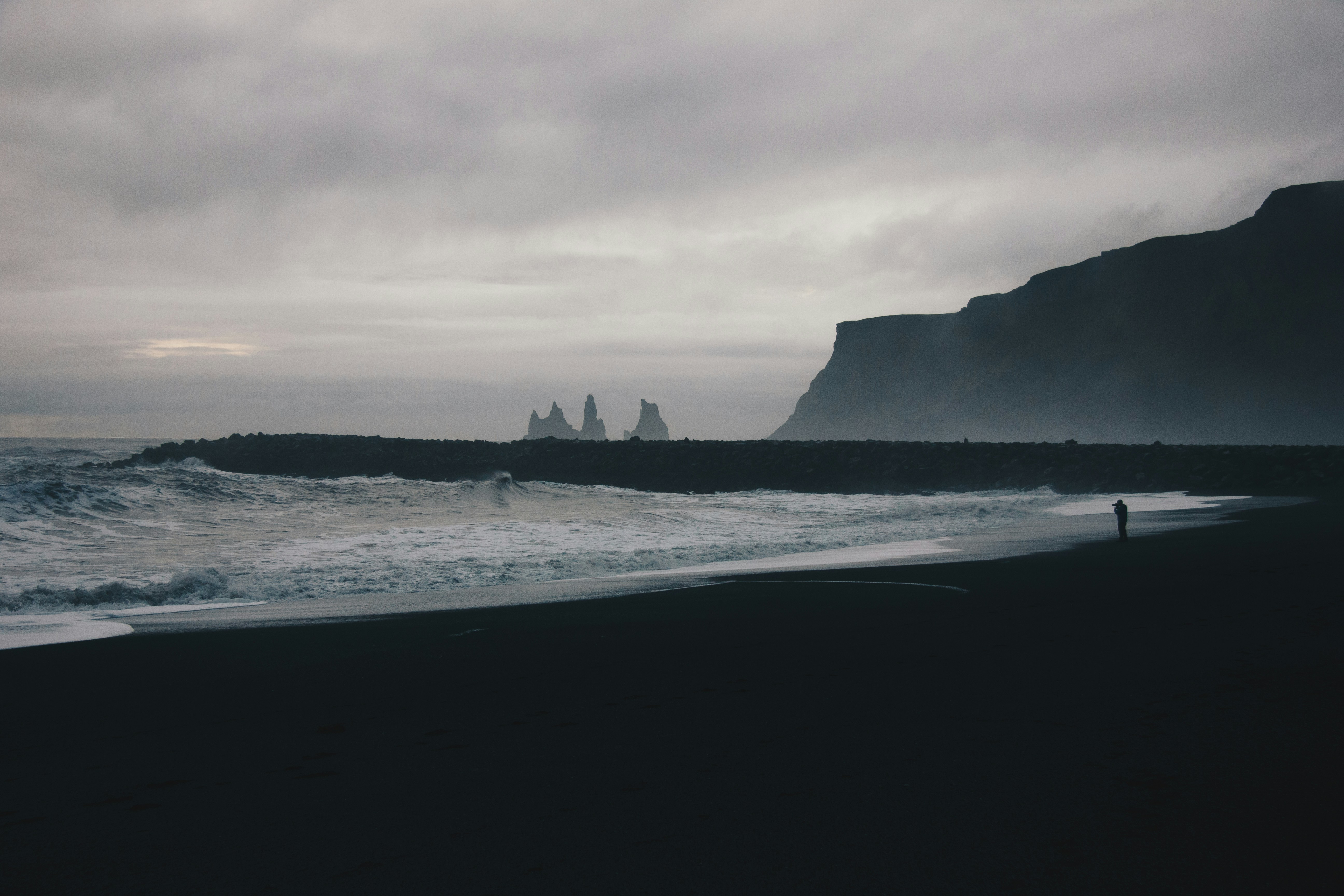 gray, misty shoreline with craggy rocks