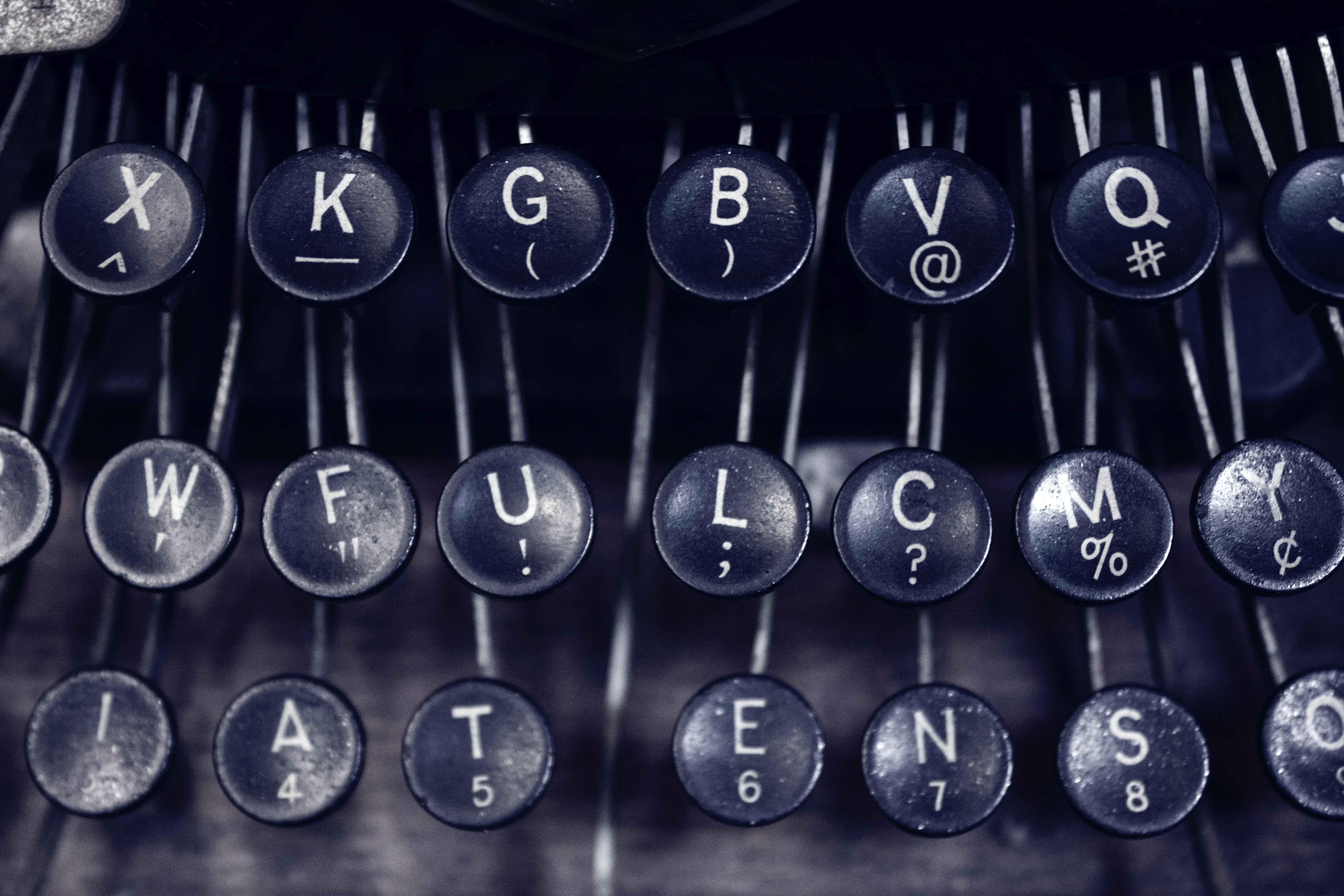 close-up of typewriter keys, grayscale