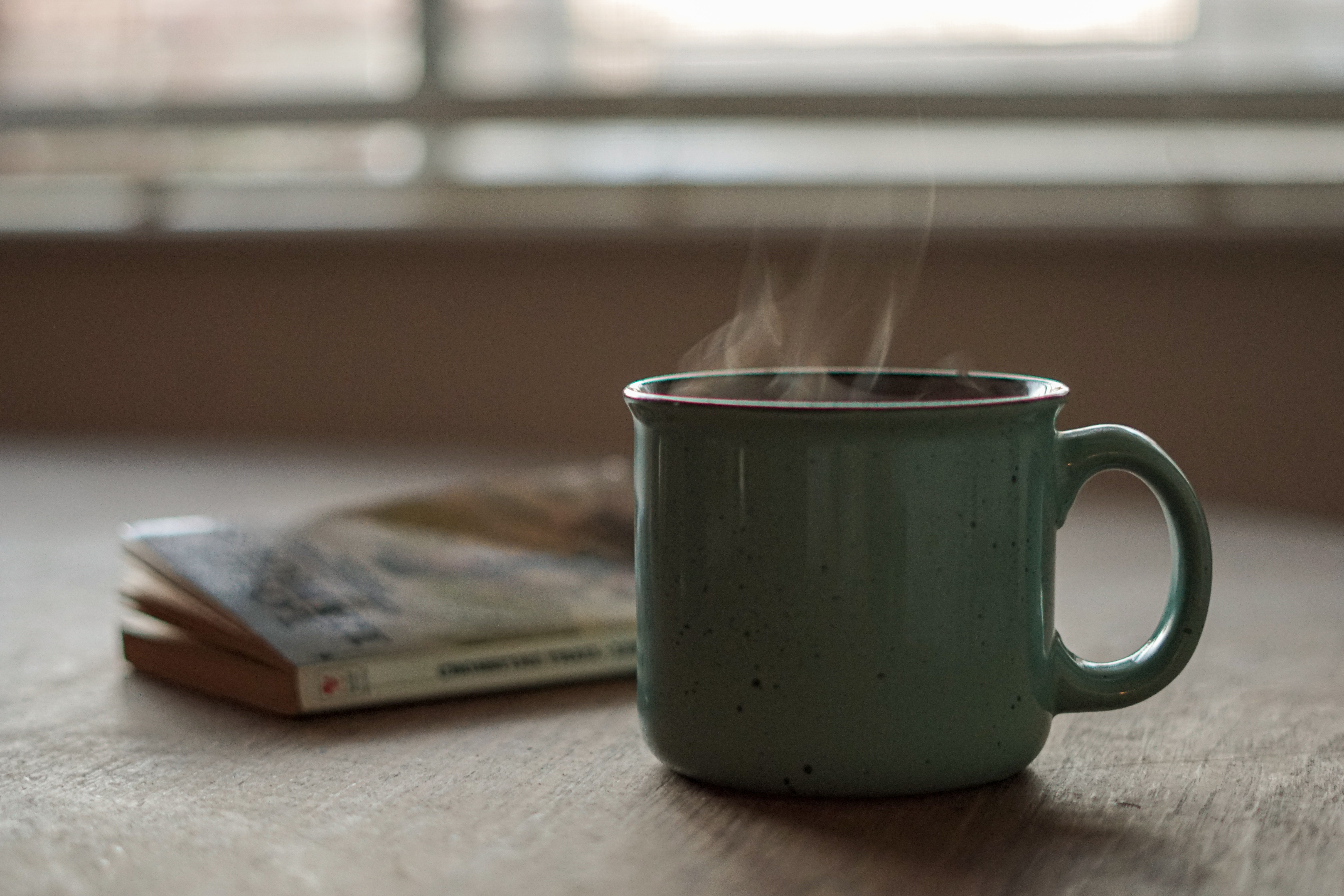 cup of tea or coffee by a book