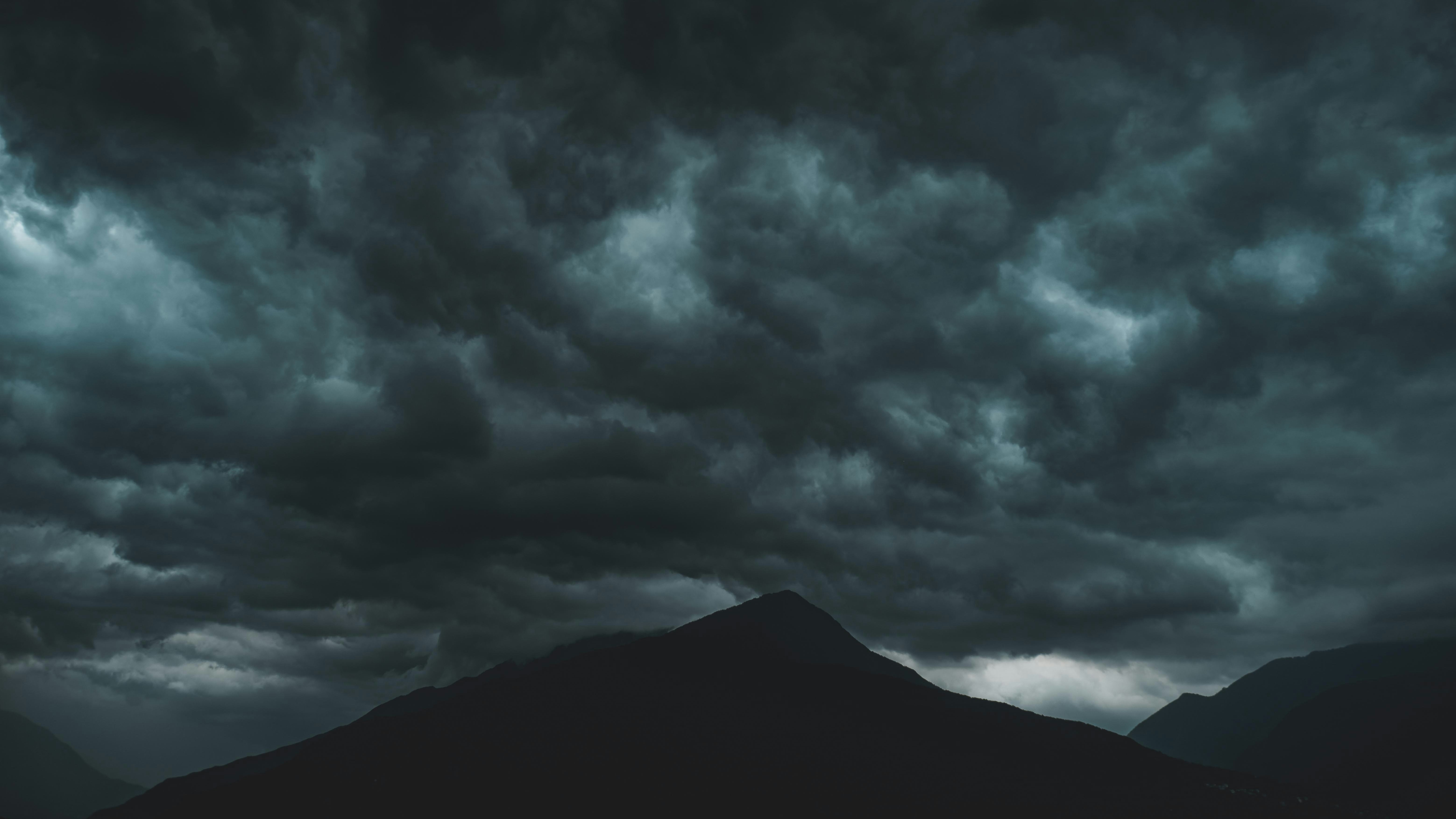 dark storm clouds over mountains