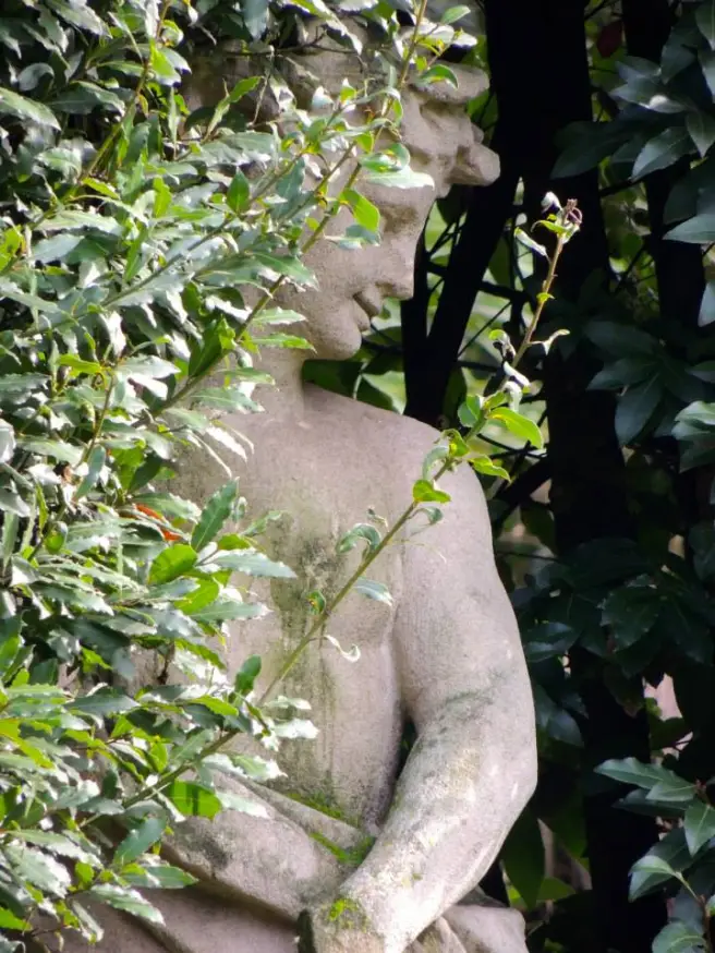 mossy statue looking to right