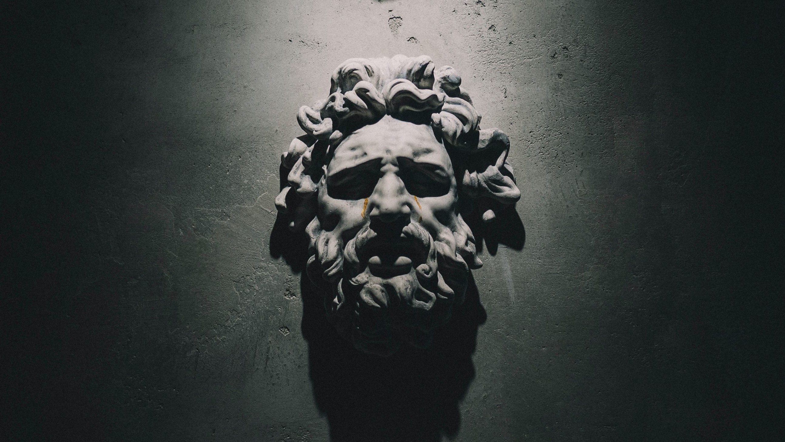 human faces engraved in stone