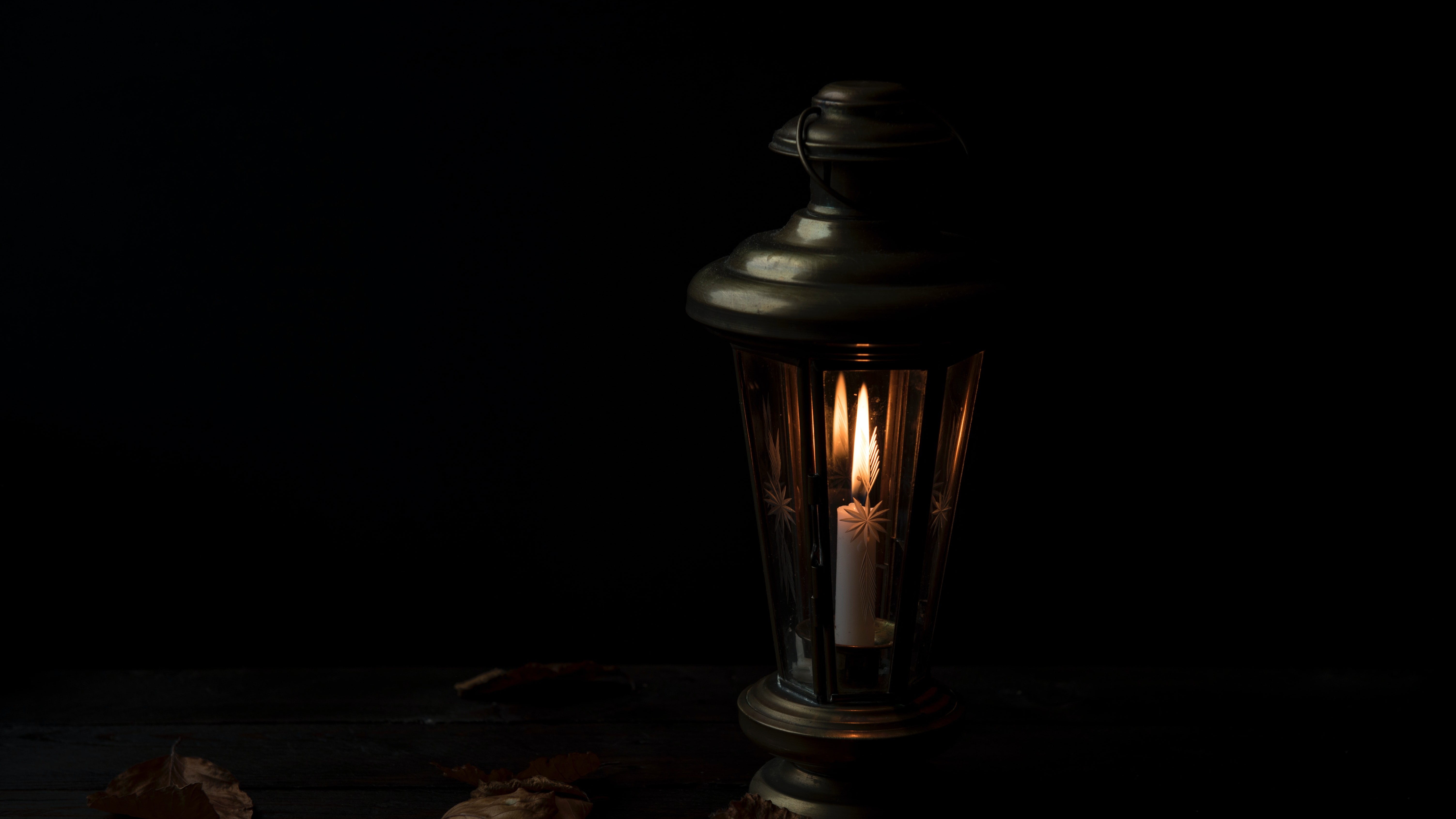 dimly lit lantern in darkness