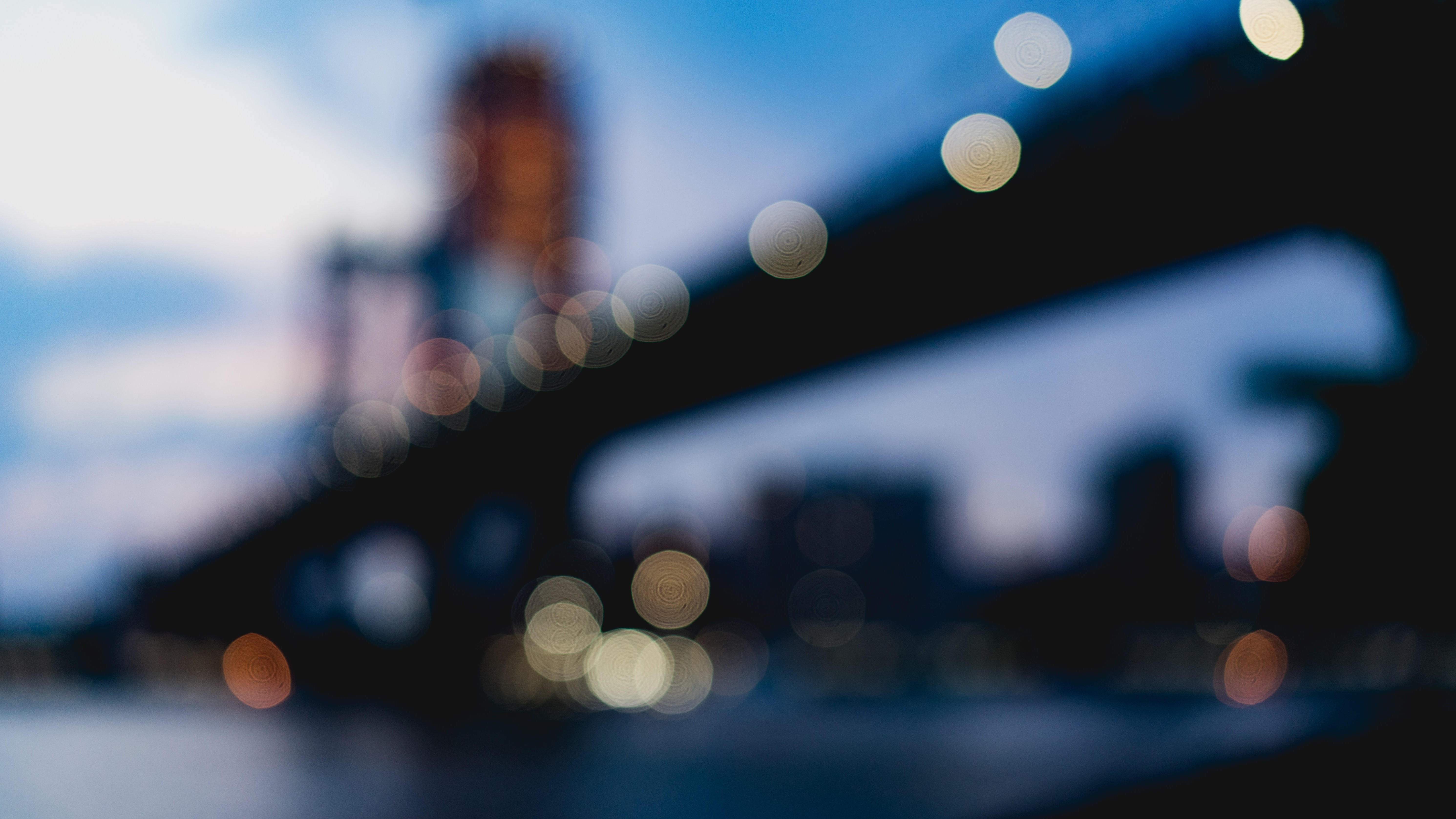 blurred city lights with bridge in background