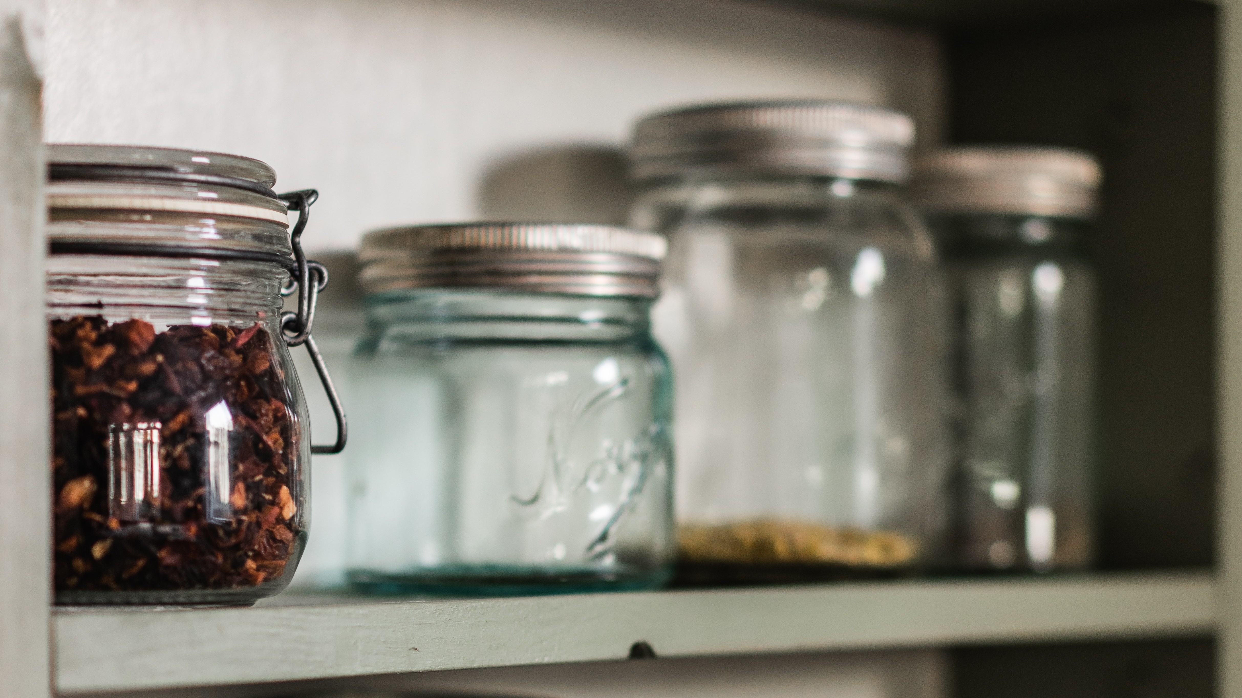 spice jars in a cupboard