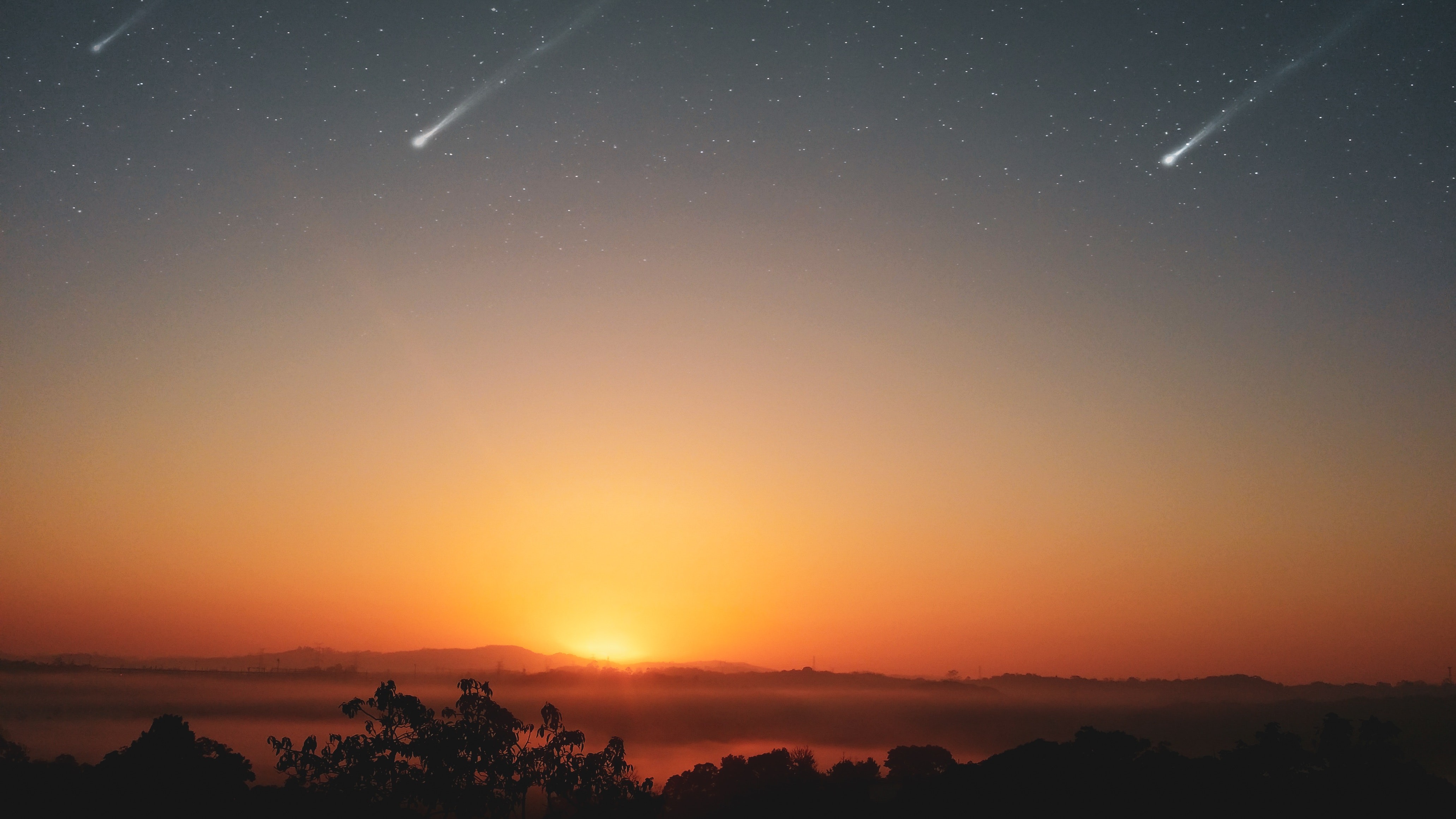 stars falling in orange sky