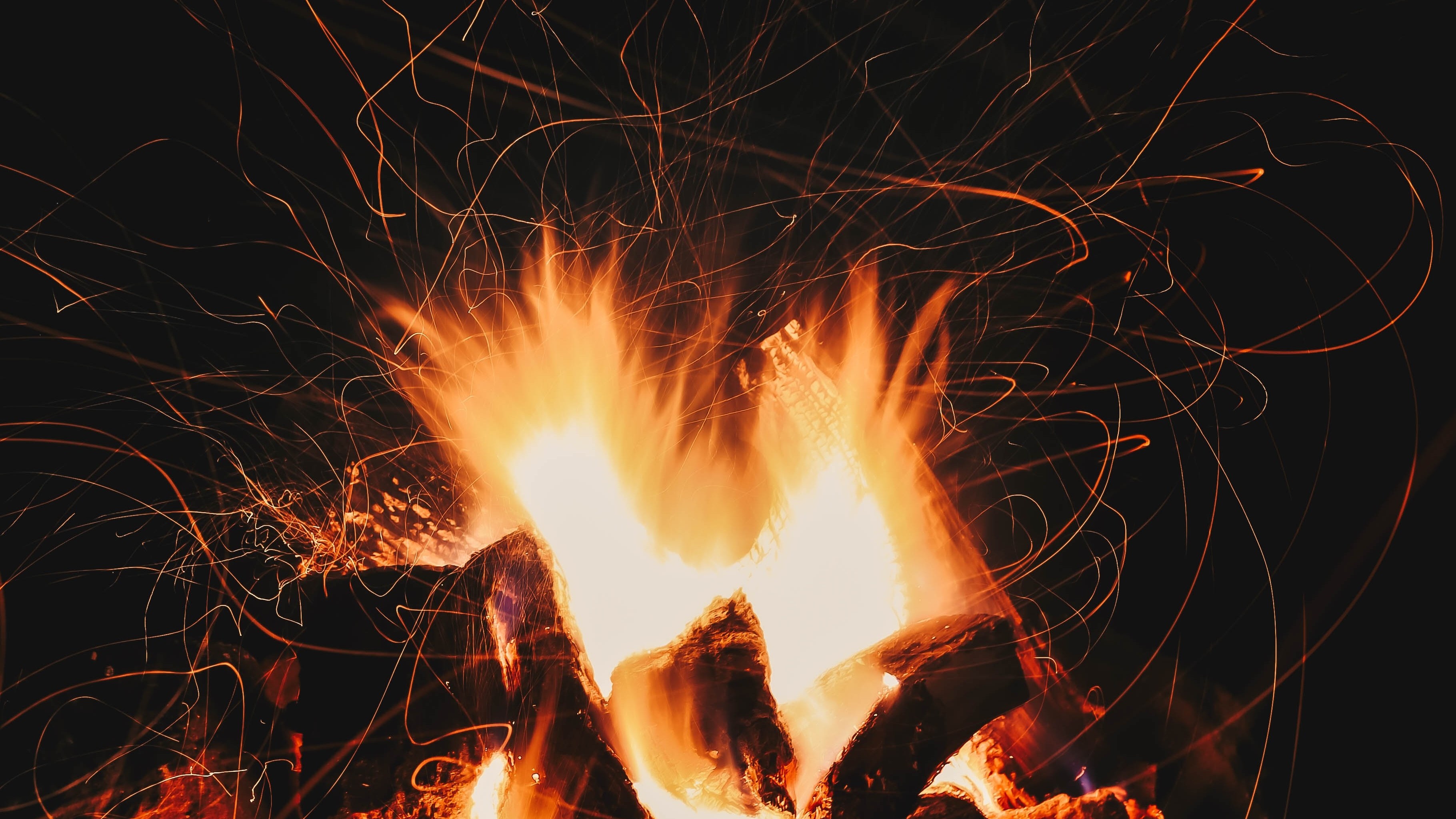 flame kindling against a dark background