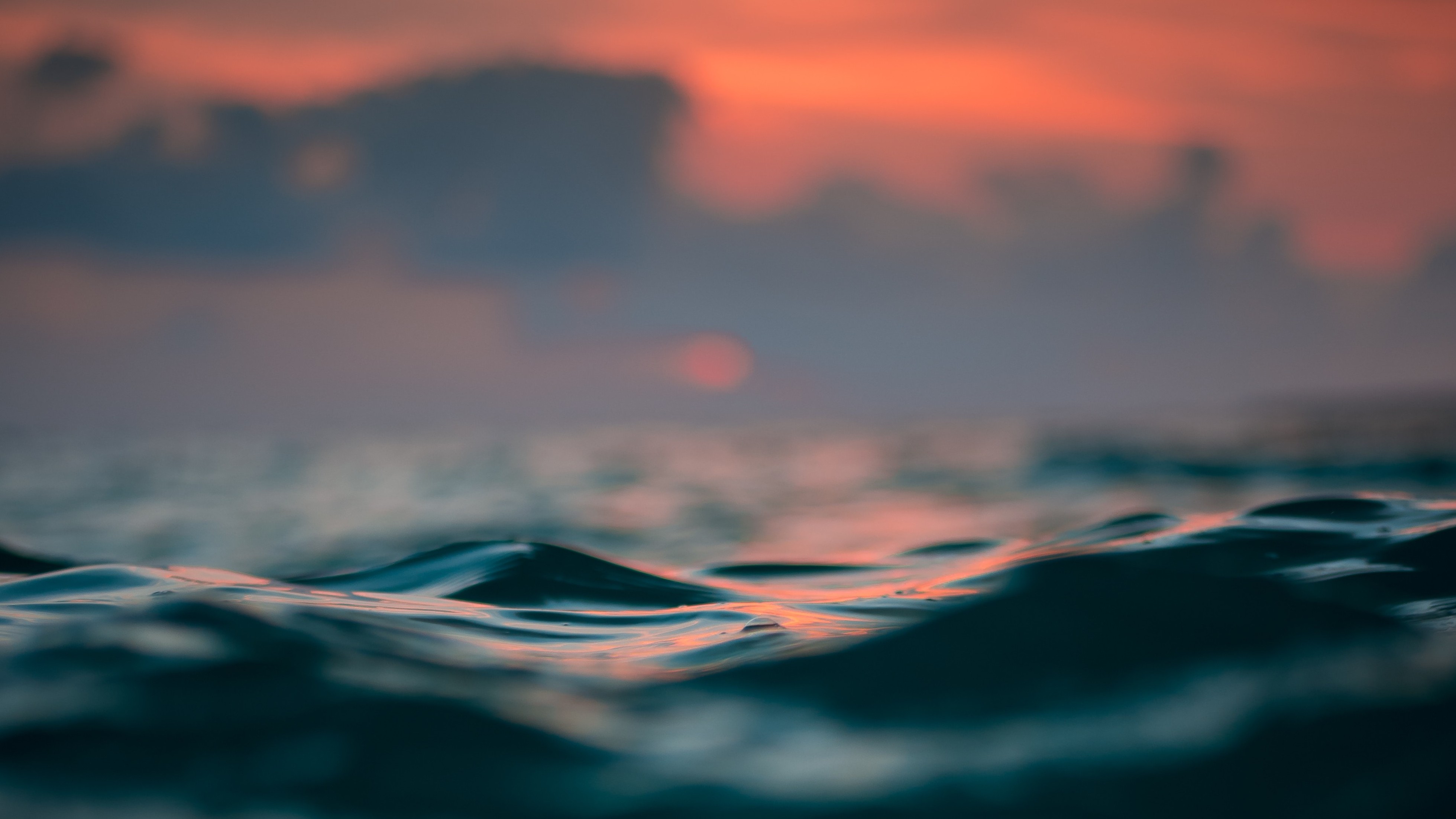 macro shot of sea wave at sunset