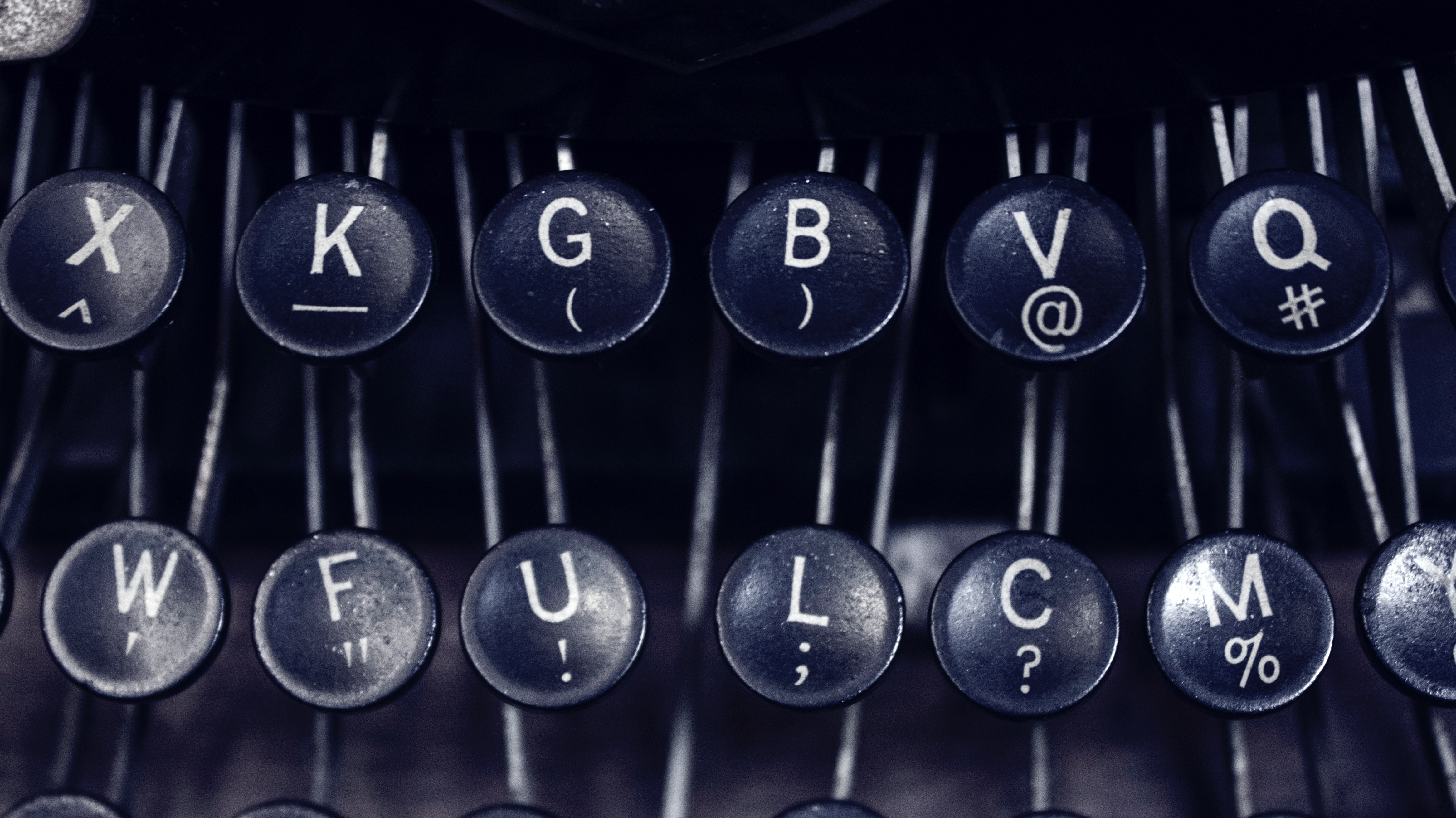 close-up of typewriter keys, grayscale