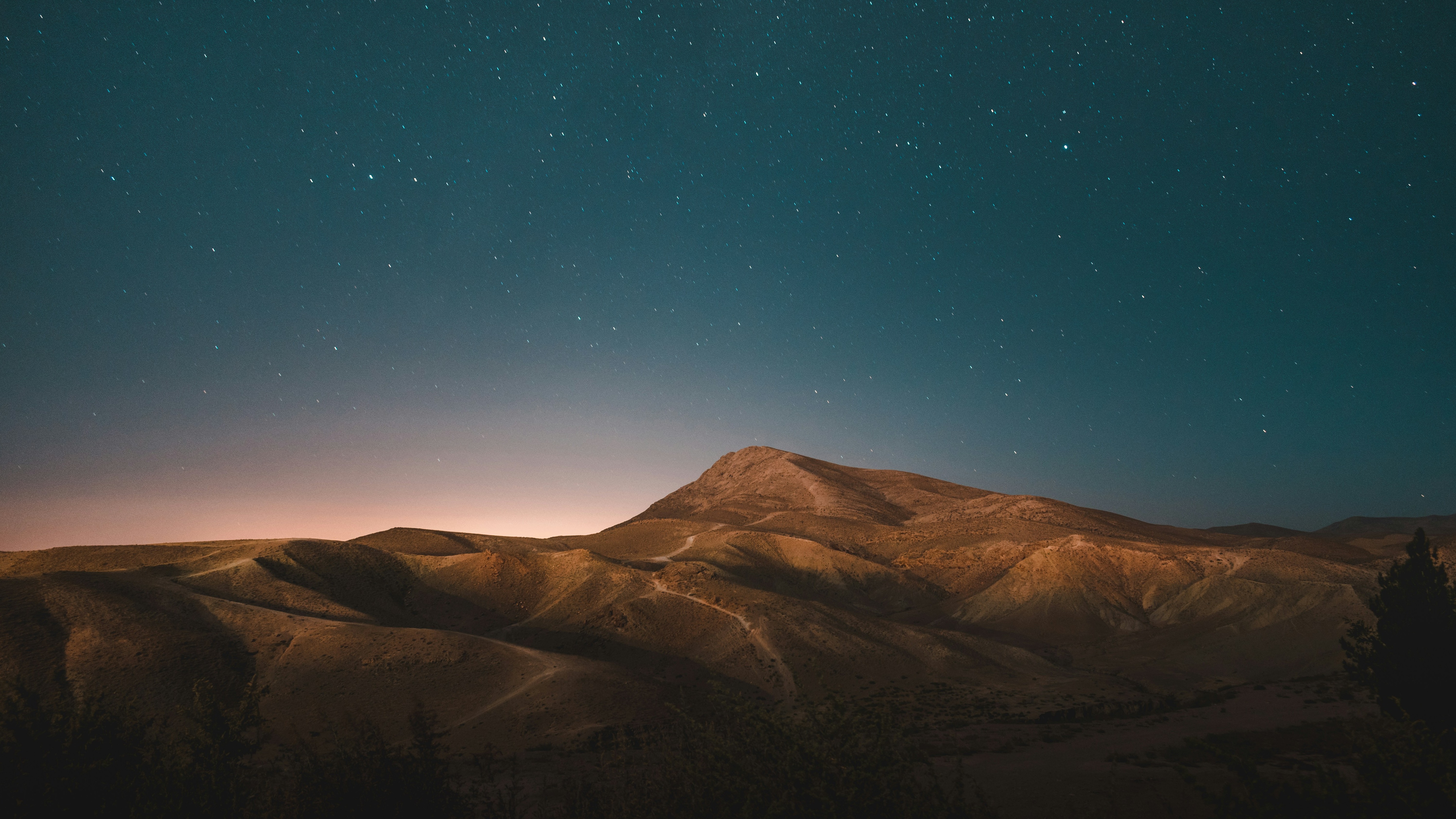 barren desert landscape with starry sky