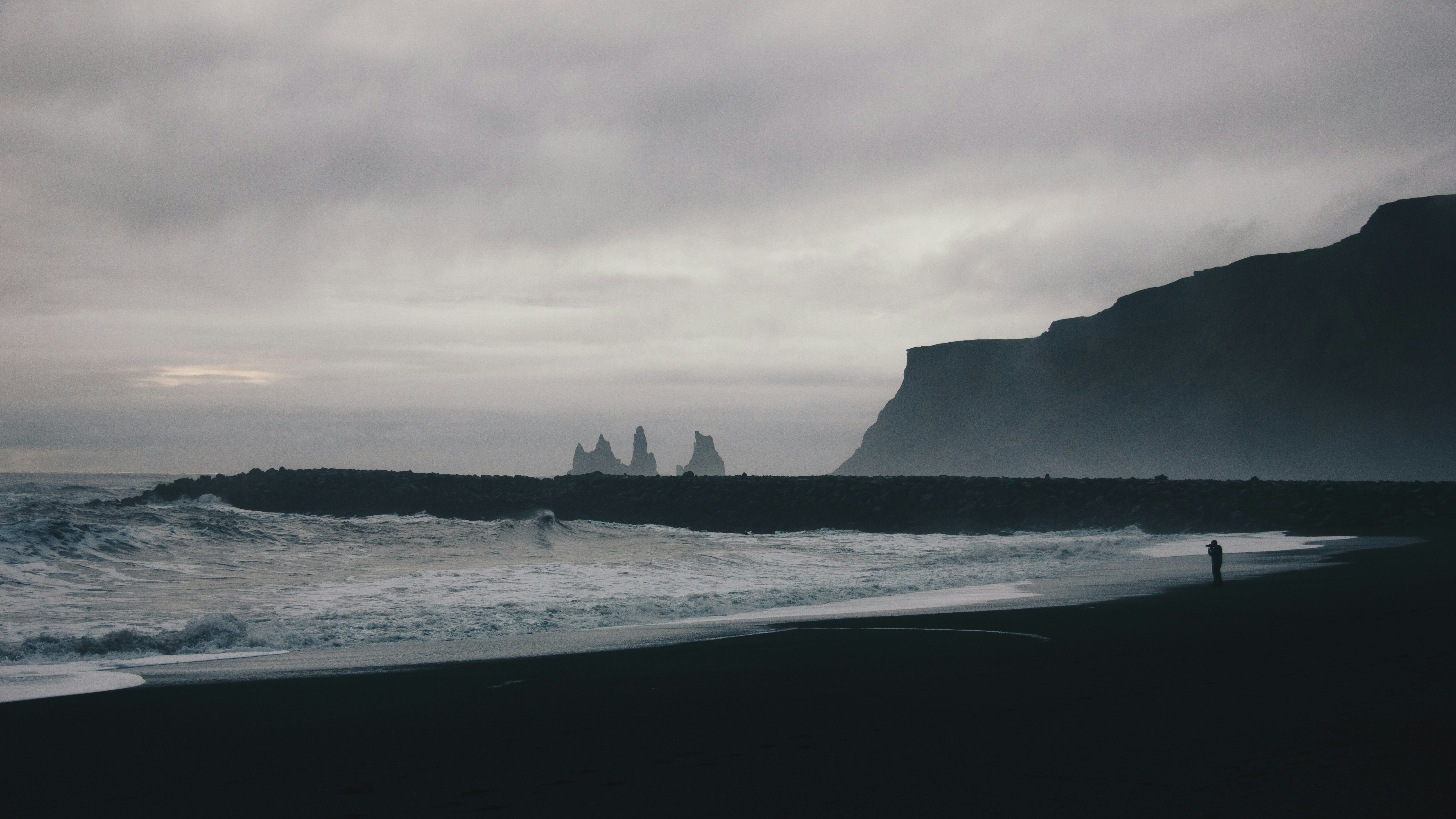 gray, misty shoreline with craggy rocks