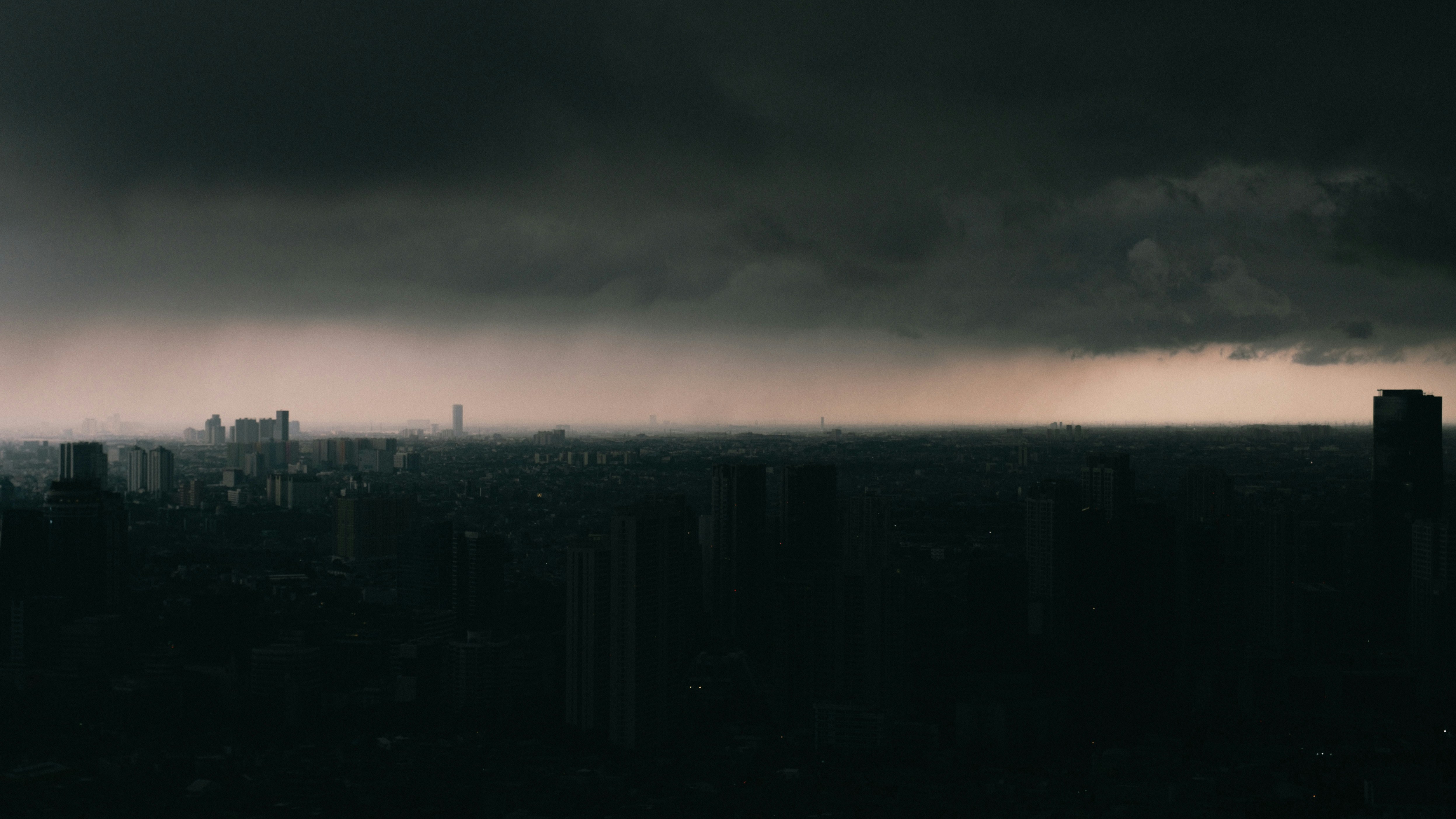 dark clouds over gray city