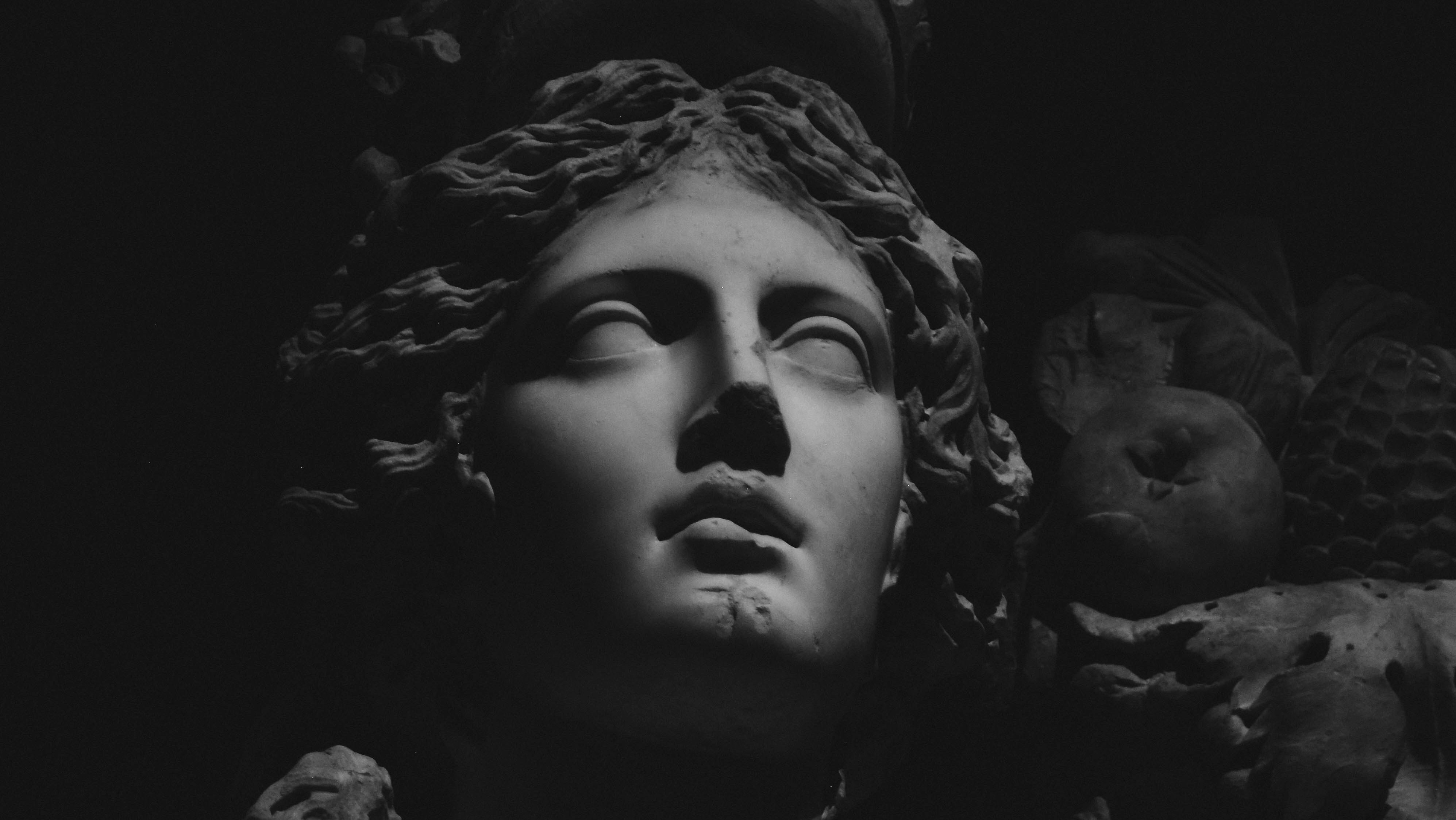 shadowy black and white image of statue of athena