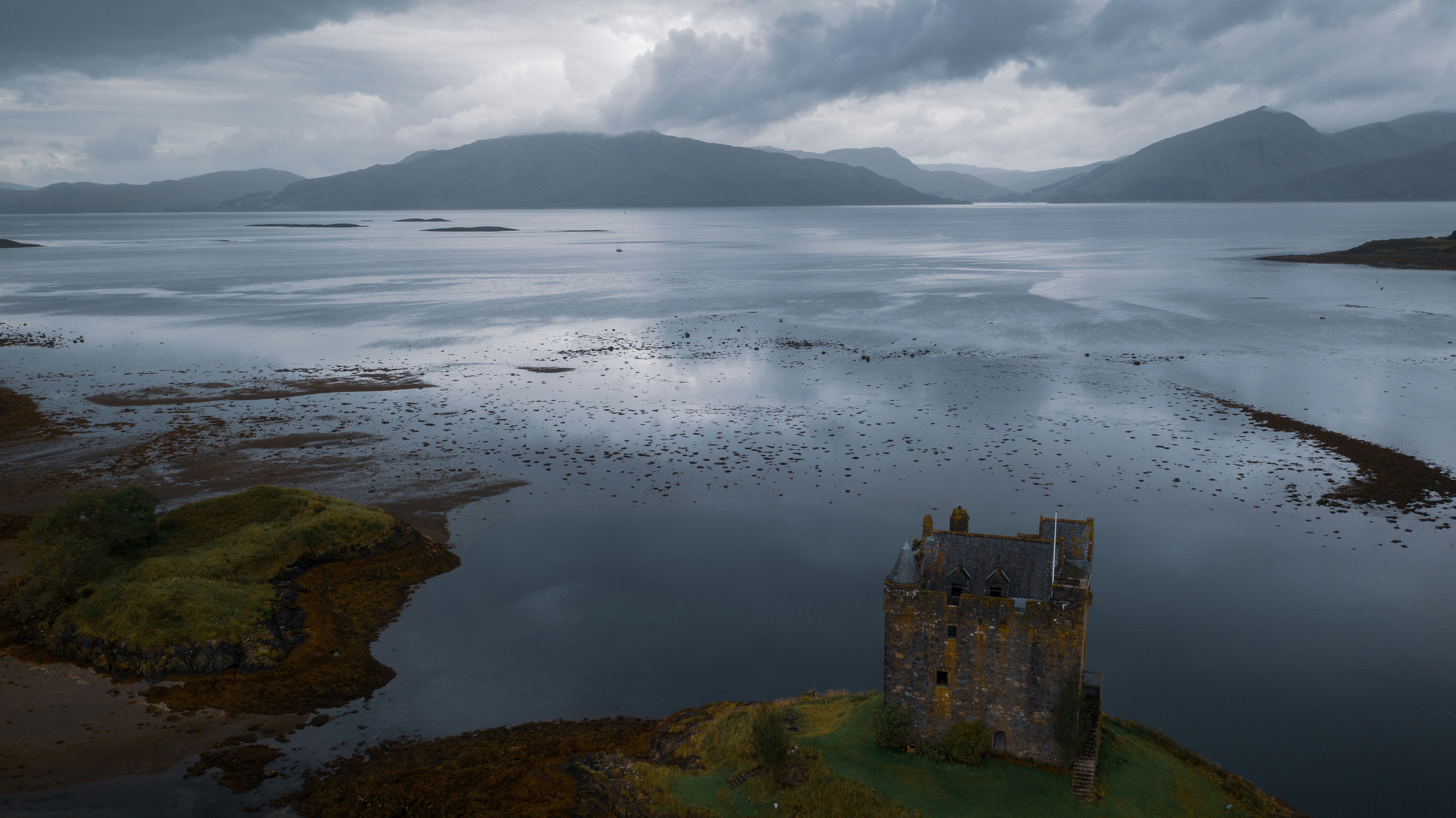 overhead view of castle building on shore
