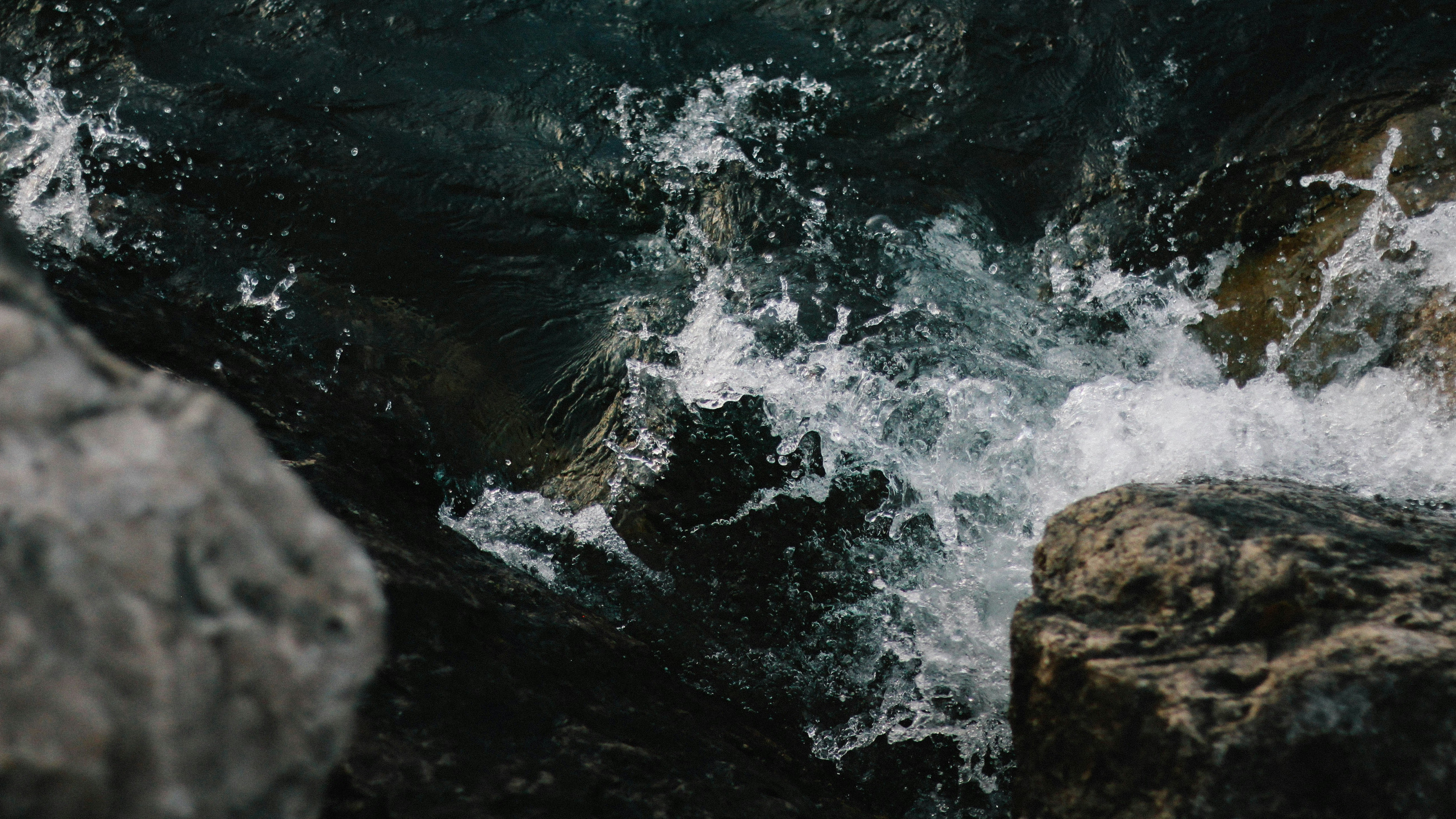stormy water around rocks