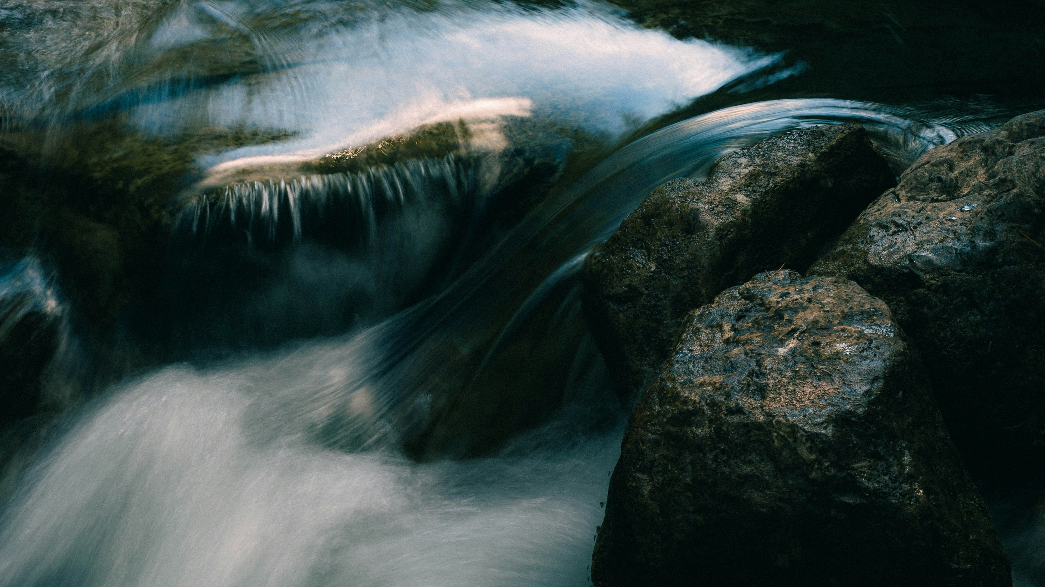 flowing water over river rocks