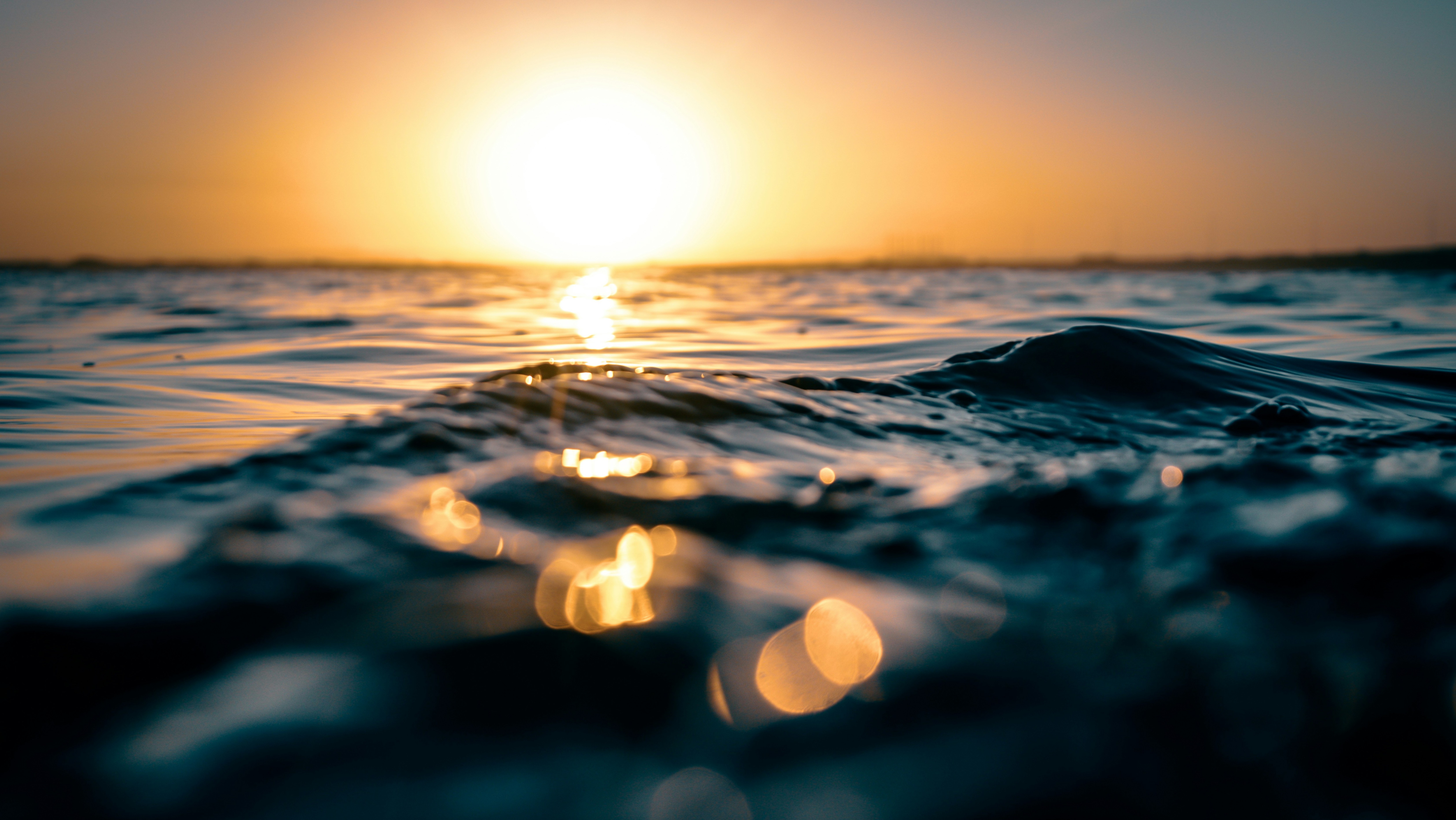 sunset behind water