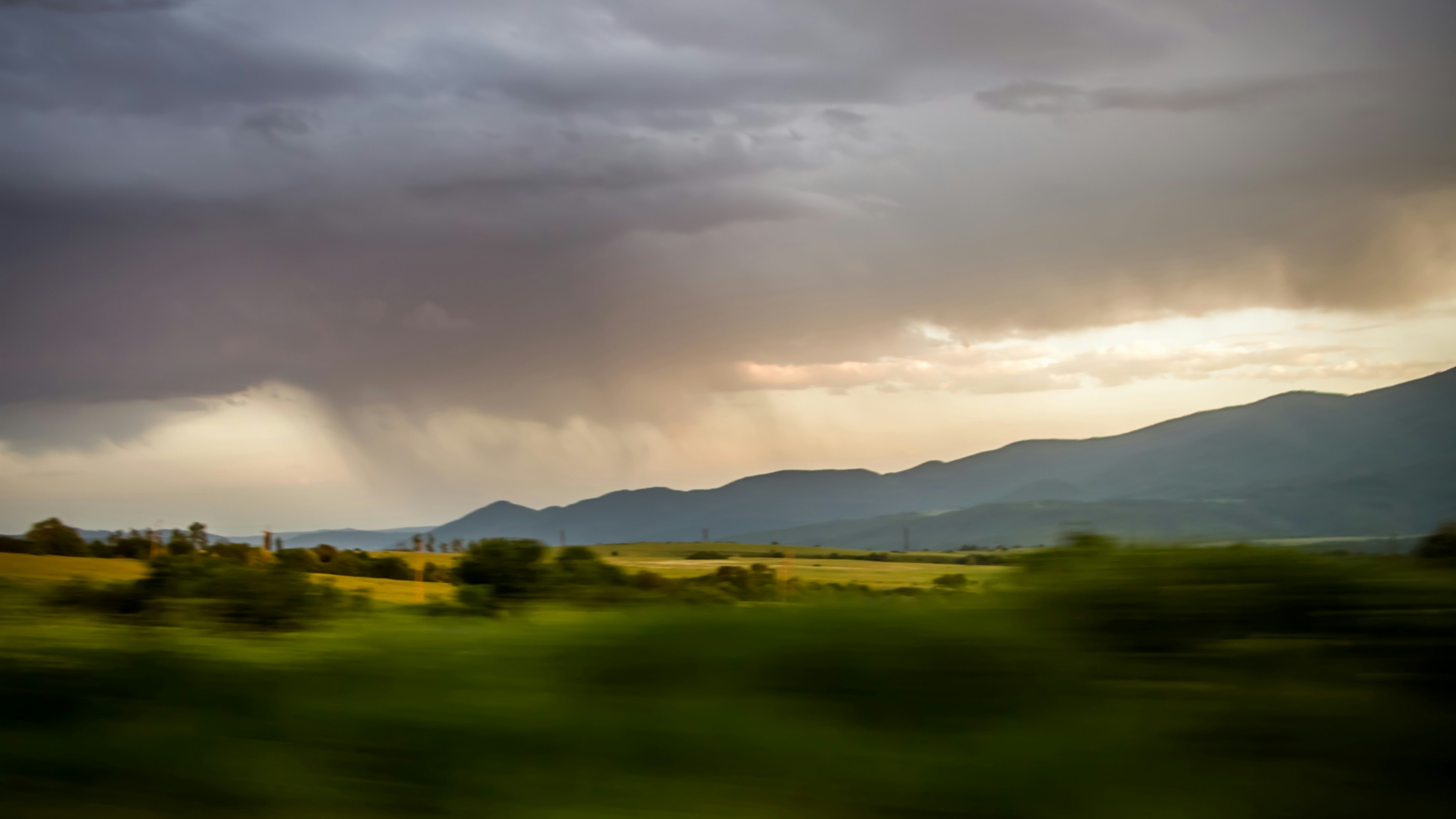 sweeping storm clouds over mountain range