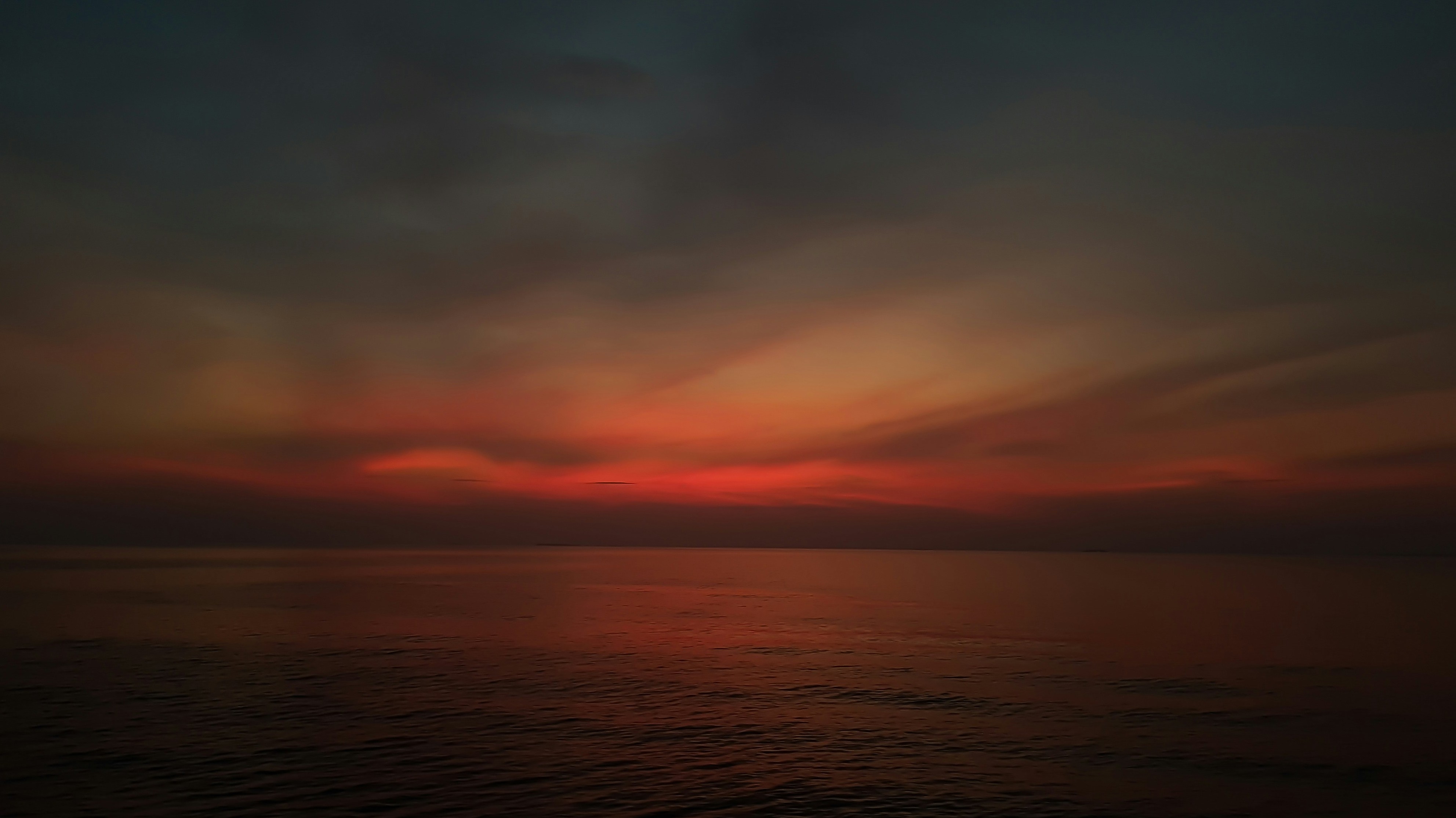 sunset over dark water