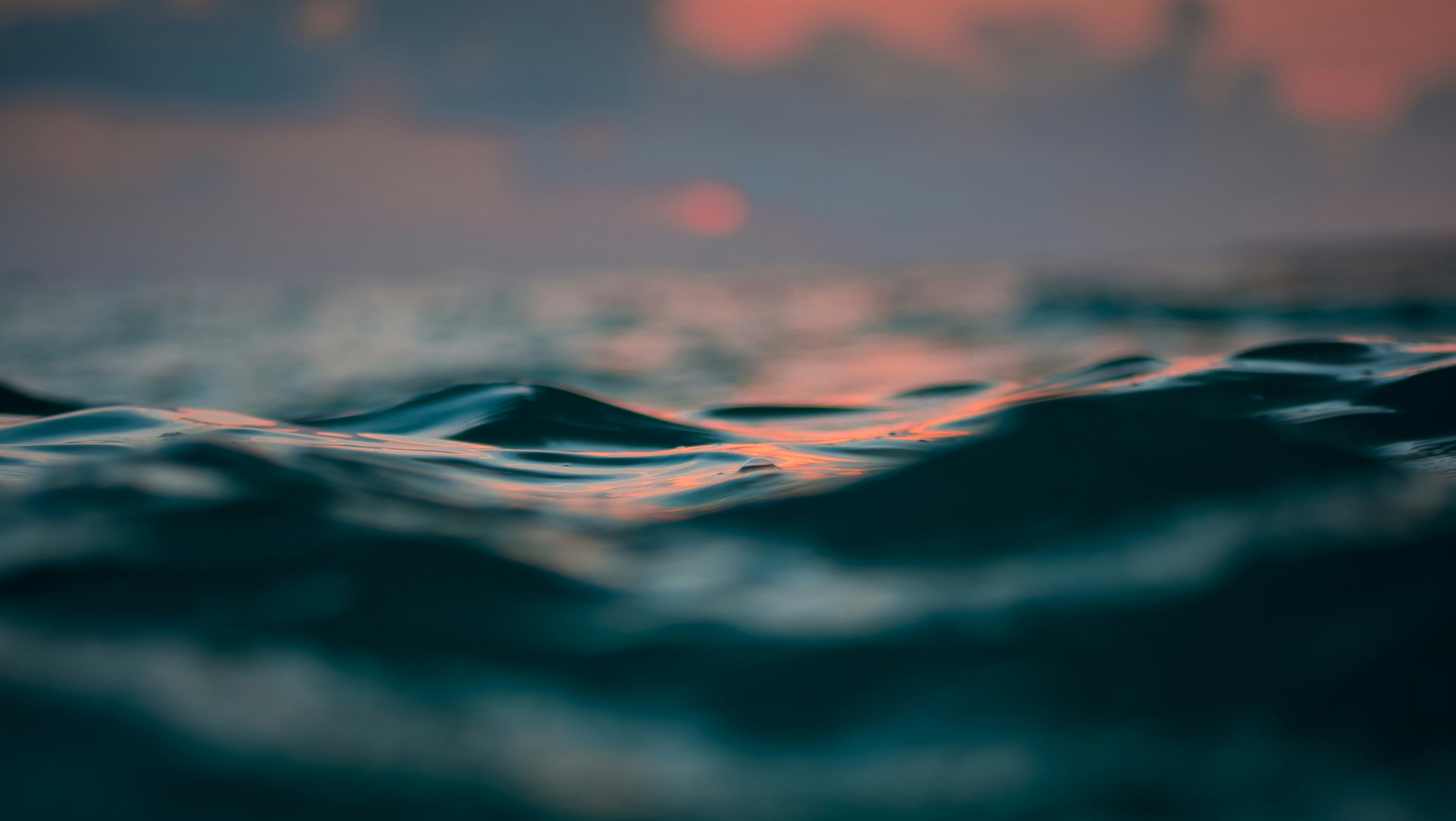 close-up of ocean waves at sunset